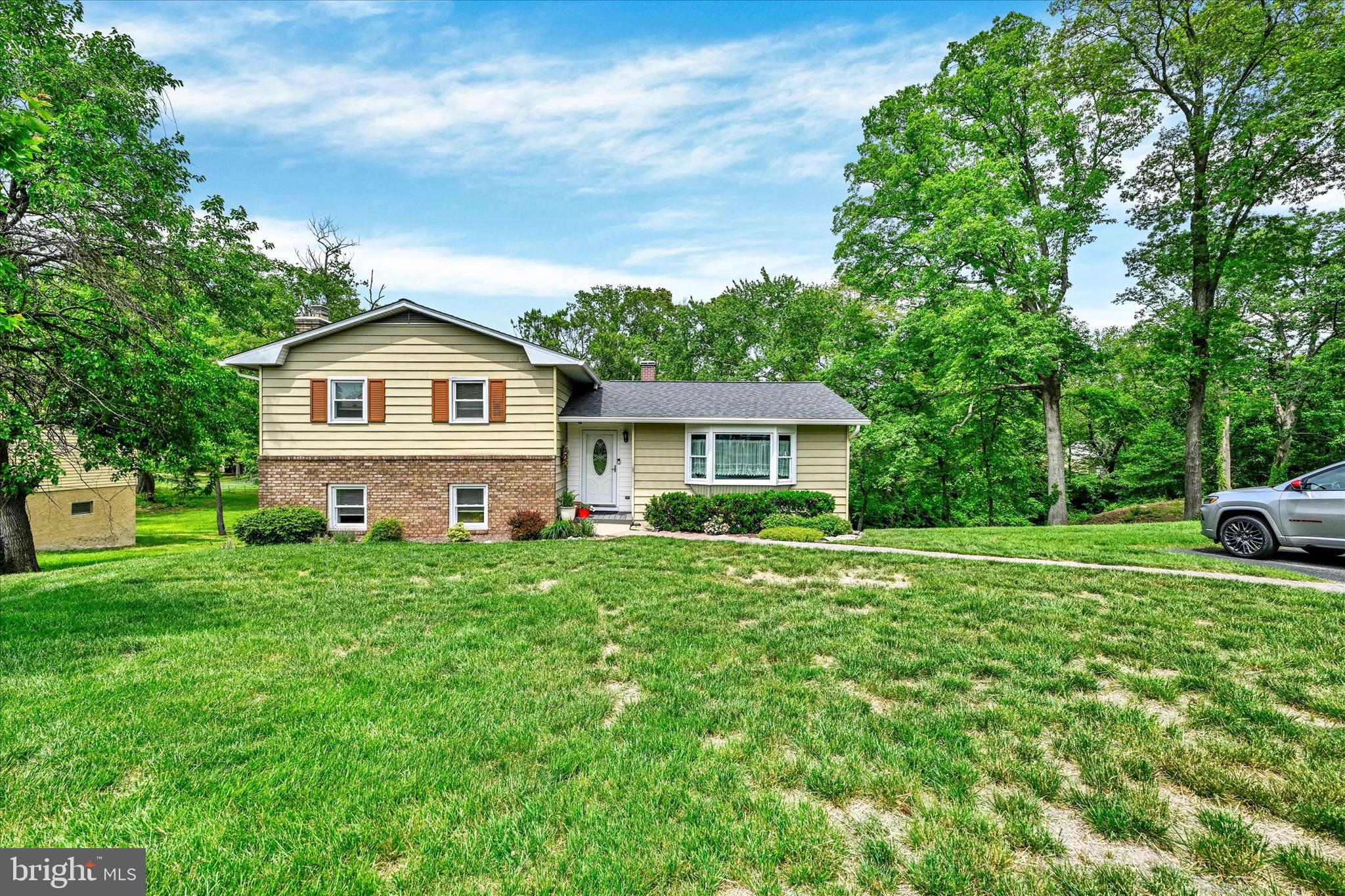 This four level split is turn-key and beautiful, a wonderful place to call home! The main living level includes a spacious living room, generous dining area and renovated kitchen. Back door leads to a large covered deck w/ sky-lites to enjoy this warm weather season! The upper level affords three bedrooms and two full baths. A lower level includes a large family/recreation area with a gas fireplace. It does not end here, there is yet a fourth level which includes utility, laundry, storage and a rear exit to a concrete patio below the deck. All of the major components of this home have been addressed over the last few years. Seller requests the use of Mid-Atlantic Settlement Svcs and Kimberly Puller for closing at the Century 21 Don Gurney on Mountain Road. Propane tank is leased and there is a conservation easement in the rear yard. This home is located in the Rock Hill community. This beach community association is voluntary and residents have access to a park and community pier and boat ramp. For more info check out their website.