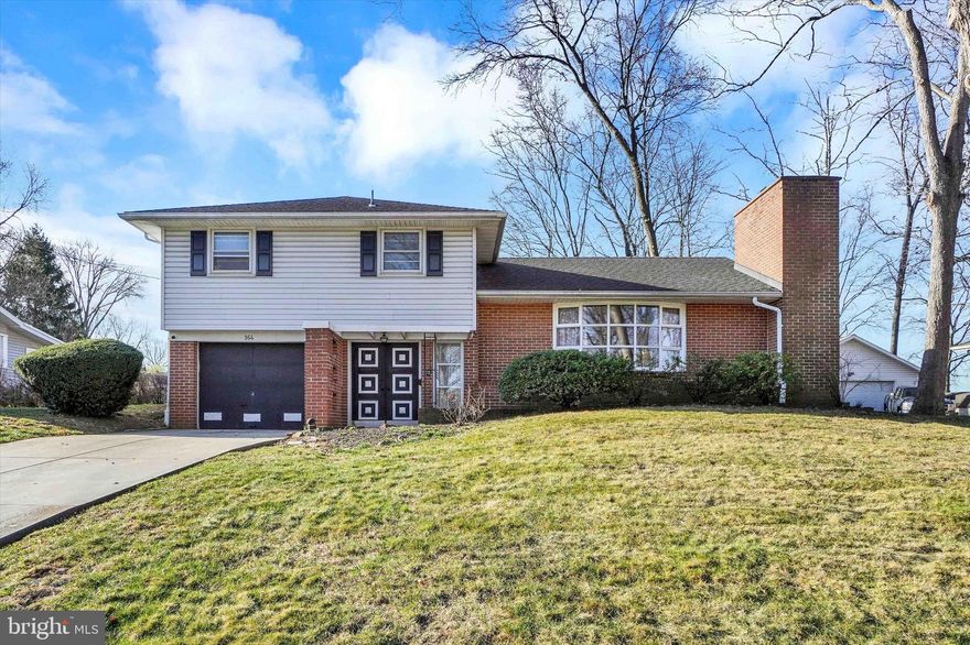 This beautifully updated (yet still feels like a mid century modern) split-level home is situated near the end of a tranquil cul-de-sac, offering stunning panoramic views. Featuring 3 bedrooms and 1.5 baths, this home is designed for comfortable and convenient living. Upon entering, you'll find a spacious living room, complete with a cozy fireplace and a picturesque bay window, creates a warm and inviting ambiance, a charming eat-in dining area, perfect for hosting guests.  The enclosed four-season sunroom is a true highlight, flooding the room with natural light while offering breathtaking views of the outdoors.  Laundry is just off the kitchen - the washer and dryer will remain with the house. Step outside to the backyard, an ideal space for outdoor gatherings and activities. Additionally there is a shed to the rear of the yard. A one-car garage ensures secure parking, and the basement provides a work space and plenty of storage. The home features 3 zoned heating, pull out drawers in the kitchen and a newer roof. Located just minutes from I-83, this home offers easy access to shopping, coffee shops, and gas stations, making it a perfect blend of serenity and convenience.