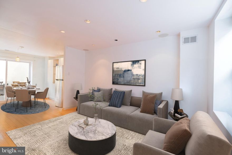 Discover the perfect blend of charm and modern comfort in this beautifully updated 2-bedroom, 2-bathroom home located in the heart of Bella Vista, just minutes from the iconic Italian Market. Thoughtfully designed with an open-concept living and dining area, this residence offers an inviting flow ideal for both everyday living and entertaining. Gleaming hardwood floors run throughout the home, adding warmth and elegance to every room. The newly renovated bathrooms feature sophisticated tile and marble finishes, bringing a touch of luxury to each level. A gracious second-floor bedroom is paired with a stylish full bath, while the light-filled primary suite on the third floor boasts a spectacular, spa-inspired bathroom and ample space to unwind. Step outside to your own private garden oasis—perfect for morning coffee, al fresco dining, or peaceful relaxation. This exceptional home offers classic Philadelphia character with contemporary upgrades in one of the city's most vibrant and walkable neighborhoods.