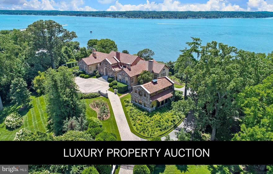 An exceptional opportunity presents itself with this magnificent Mediterranean villa, encompassing over 14,000 square feet of unparalleled craftsmanship and offering sweeping vistas over the Chesapeake Bay within commutable distance of Washington D.C. and Baltimore. Situated on more than three acres of meticulously landscaped grounds atop a prominent elevation within the exclusive enclave of Gibson Island, this historic estate seamlessly blends old-world charm with contemporary luxury. Completely renovated in 2009 to include all new systems, including geothermal temperature control, the villa, originally constructed by Robert Garrett to graciously entertain two to two hundred friends, boasts five en suite bedrooms, six full bathrooms, three powder rooms, a wine cellar, and a sauna. Distinguishing features include artisanal finishings, a serene library, an expansive great room with a grand fireplace, and a gourmet kitchen that flows into a glass conservatory and family room, all opening to terraces with breathtaking water views. The estate's outdoor amenities feature pergolas beside a heated pool, hot tub, outdoor kitchen, and lush gardens, complemented by a fully appointed Coach House with a movie theater and studio apartment with additional full bath and half bath. Gibson Island offers unparalleled privacy and security, a private country club (membership by invitation) with an award-winning nine-hole golf course, yachting, fine dining, tennis, swimming, croquet, and skeet shooting. This legacy estate epitomizes refined waterfront living.