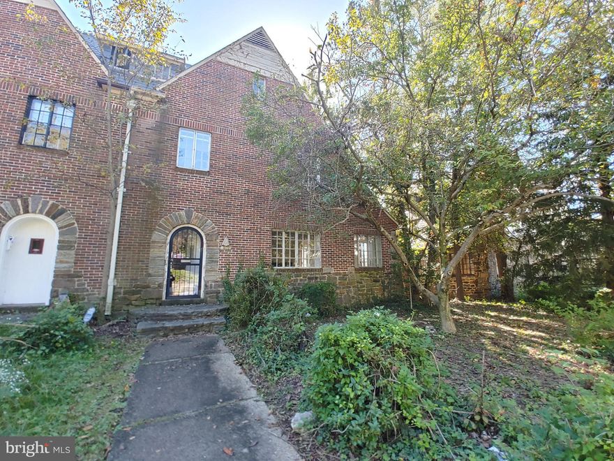 Don't miss this solid brick semi-detached home in Waverly neighborhood. Home has spacious room sizes, large living room with fireplace that leads to sunroom with wide windows, separate formal dining room, eat-in kitchen and an attached garage. The 2nd level has 4 bedrooms and a full bath while the attic has 2 bedrooms, a full bath and a 2nd kitchen. The basement can be used as added storage or finish off for more living space.  Great neighborhood - walking distance to John Hopkins Campus. Near shopping, schools, hospital and parks.