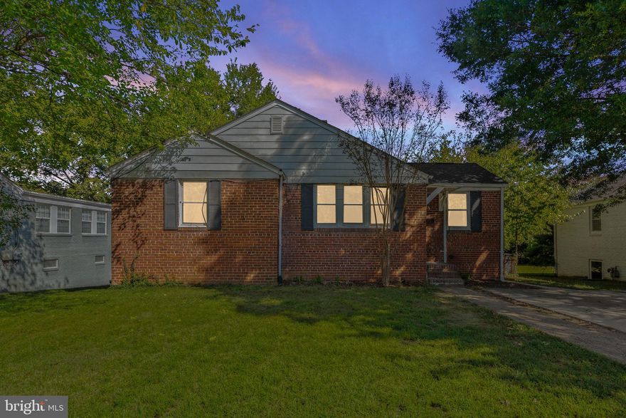 Solid all brick rambler with newer roof, windows, paint, carpet and updated bathrooms.  Charming front porch welcomes you into the open living/dining room with wood burning fireplace.  Updated kitchen with new stainless steel appliances and rear door to covered deck.  Partially finished lower level with 4th bedroom/den and full bathroom.  Plenty of space for additional storage or additional finished living space.  Private rear yard with expansive concrete patio - perfect for relaxing or entertaining.  Close in proximity to Old town, Carlyle Center, Woodrow Wilson Bridge and Fort Belvoir.  Aldi and Wegmans are just a short drive.  Don't miss out on the opportunity to make this your HOME!!