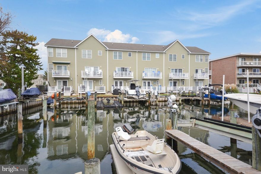 Welcome to your dream coastal retreat in Ocean City, MD! Nestled along the picturesque canal, this stunning 4-bedroom, 3.5-bathroom townhouse offers the perfect blend of luxury, comfort, and waterfront living. Step into a fully furnished haven where every detail has been thoughtfully curated to provide a seamless blend of style and functionality.  Boat Slip #4 is included in the sale of the property and features a powered boat lift (up to 7,500 lb).  

As you enter, be captivated by the open-concept living space, bathed in natural light, and adorned with tasteful coastal decor. The spacious living area invites you to unwind and entertain, with plush furnishings and scenic views of the canal just beyond your doorstep. The well-appointed kitchen, complete with modern appliances and ample counter space, is a culinary enthusiast's delight.

Each of the bedrooms are a private oasis, boasting serene views and comfortable sleeping quarters. The owner suite is a true retreat, featuring a generously sized walk-in closet, and a spa-like ensuite bathroom. The additional bedrooms are equally inviting, providing ample space for family or guests.  The den area on the main floor features a full bathroom and could be utilized as an additional bedroom.

With three and a half bathrooms, convenience is at your fingertips, ensuring everyone has their own space to relax and refresh after a day of enjoying Ocean City's beaches and attractions.

Step outside to your private deck, where the canal becomes an extension of your living space. Whether you're sipping your morning coffee or hosting a sunset gathering, the waterfront ambiance creates a tranquil backdrop for every occasion.  

This townhouse not only offers a beautiful home but also a prime location, with easy access to the vibrant energy of Ocean City. Explore the nearby shops, dine in the acclaimed restaurants, or take a short stroll to the sandy shores – the possibilities are endless. 

This property could make a fantastic rental, with yearly estimates upwards of $58,000. A rental market analysis provided by BluVista Vacation Rentals is available in the uploaded documents. 

Don't miss the opportunity to make this fully furnished canal front townhouse your own, where luxury and coastal living converge to create the perfect Ocean City haven. Your dream home awaits!