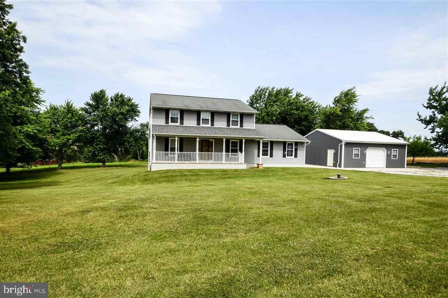 This home has been freshly painted, has new flooring and an updated kitchen!  You will love the huge family room with cozy pellet stove and vaulted ceiling.  The detached 2+ car garage has plenty of work space, storage space, and has propane heat as well! The lovely level lot offers pastoral views for miles around. Home has had updated HVAC, siding, gutters, downspouts, windows, doors and roof, so virtually maintenance free!