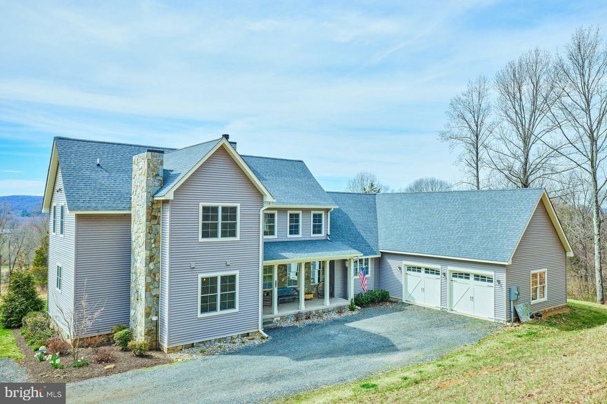 OFFER DEADLINE SUNDAY 5PM.  NO DRIVE BYS! DO NOT DRIVE UP PRIVATE ROAD WITHOUT AN APPOINTMENT!  Amazing opportunity to buy a "like new" home on 50 acres near Gold Cup in The Plains!  Custom Built home with Front and Back Covered Porches, Virginia Bluestone on Front & Back Below the Porch Roof, Bluestone Water Table and Chimney.  Two Levels with Wide Oak Flooring.  Open and Light with Double Slider from the Great Room to the Back Porch and Fenced Yard Area with Paver Patio where you can enjoy the Magnificent Sunsets!  Cooks Kitchen with so much Counterspace (Quartz), Cabinetry with Under Cabinet Lighting and 36" Big Chill Classic 6 Burner Industrial Revival Range, Kitchenaid French Door Refrigerator, Kitchenaid Dishwasher with Cabinet Panel on Front, Trash Compactor and Work Area with space for future Warming Drawer and Built in Microwave. Table Space in the Breakfast Area + Walk in Pantry!  The long Island has space for 6 barstools! Separate Dining Room has a Gas Fireplace with a Reclaimed Heart Pine Mantel from the 1850's.   2 Main Floor Suites.  Primary Bedroom with Double Door Entry, 2 Walk in Closets and a 20' Ceramic Tile Bath leading through to the Laundry Room.  Laundry Room with Wet Sink and Whirlpool Cabrio Washer and Dryer.  There is also a Powder Room off the Foyer with Wainscoting, Chair Rail and Stenciling above.  2nd Suite behind the Kitchen has a walk in closet and Full Bath with LVP floor and Ceramic Tile Shower along with Granite Top on Vanity. 
Up the Wood Stairway to another Amazing Family Room with Soaring Ceiling & Cabinetry along one wall including a desk and entertainment area.  Also a Wet Bar with Granite Top and Built in Cabinetry on the opposite wall.  Cathedral Ceilings with Fan and Recessed Lighting in this Lovely Room Lined with Windows.  Across the Hall are 2 Bedrooms each with a Double Closet with Organizers built in.  There is a Study Area outside these bedrooms perfect for crafts or quiet studies. A walk in Storage Closet has Built In Shelving. The Upper Full Bath has a Double Bowl Granite Vanity Separate from the Tub/Shower and Toilet for added Flexibility.  The tub/Shower surround has pvc woodwork and Ceramic Tile.  There is also another room on this level that could be made into a bedroom with the addition of closets. It has Cathedral Ceiling and Lovely Windows Overlooking the Trees.
The upper level has wood flooring throughout matching the main level.
2 HVAC Systems, Propane on Main Level and Heat Pump Upstairs.  Tankless Propane Water Heater with Instant Hot!  Oversized Garage with Auto Openers plus a 11x11 area for a workshop or storage with a door to the fenced yard area.  Anderson Double Hung Windows, Veent humidity sensing exhaust fans in powder room, upper bathroom and laundry room, Auto sensing lighting in Pantry and Powder Room.  This house even has Monogram Extra Long Vinyl Siding for less seams! The house has 2x6 Construction along with a conditioned crawl space below.  3 Miles to I66, 4 miles to the Town of The Plains, 11 miles to Warrenton, 12 miles to Haymarket, 14 miles to Gainesville.  Surrounded by Fine Dining, Wineries, Breweries. Shopping and Outdoor Activities.  50 Acres with plenty of room for a barn and paddocks or just enjoy the privacy and views!  Close in April and host your 1st Annual Gold Cup After Party the 1st Saturday in May!