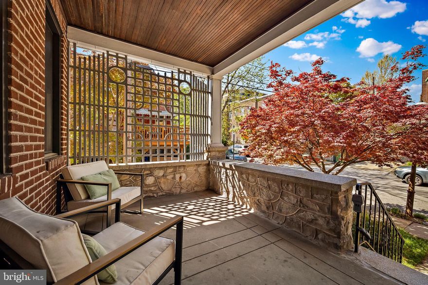 Prepare to be wowed - the belle has arrived at the ball!  This porch-front end of group  has been renovated from top to bottom with a modern flair which also respects the 1920's architecture.  In addition to  a comfortable living room, the 1st floor offers a very large dining room and  gorgeous kitchen with counter and cabinet space galore.   Natural light pours in the replacement windows  throughout. The kitchen opens to a large deck with cable-wire railings which overlooks  the landscaped backyard with custom fencing that opens wide for easy access.   Upstairs, there are 3 bedrooms and a classic hall  bath.   The above grade lower level is fully finished including separate laundry room, luxe full bath and large family room.    Even the storage room has natural light and is updated.    A truly special offering, homes like this do not come long often.