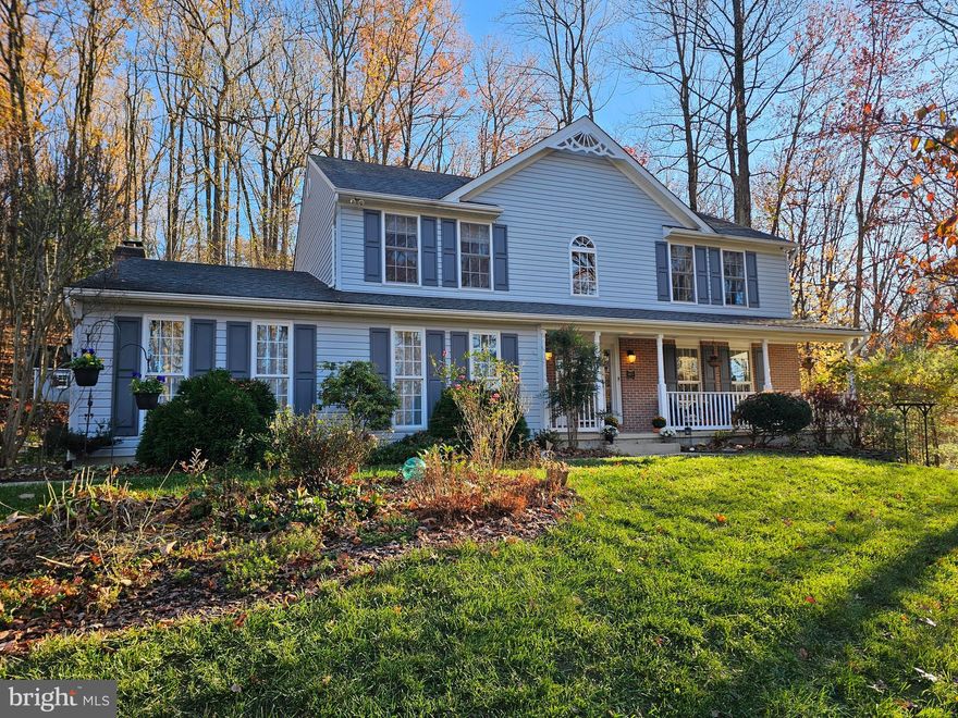 Welcome home to this charming 4 Bedroom, 3 Full Bath, 1 Half Bath, Full Front Porch Colonial situated in the sought-out Jarrettsville community of Madonna Manor. The pride of ownership is apparent in this well-maintained home owned by the original owner. As you step into the two-story Foyer, you are greeted by upgraded ceramic tile flooring that extends into the Eat in Kitchen.  The Foyer flows seamlessly into a spacious Living Room and separate Dining Room, both featuring gleaming hardwood flooring, crown molding and chair rail.  The Dining Room is highlighted by a large picture bay window that fills the space with natural light, creating a warm, inviting atmosphere.  The updated Kitchen boasts stainless appliances, recessed and pendant lighting, custom tile backsplash (2024), stunning quartz countertops (2024) and oversized sink with Moen faucet (2024).  An updated butcher block island (2024) provides ample prep space, while a pantry offers extra storage for all your culinary needs.  Adjacent to the Kitchen, the breakfast nook is the heart of the home, comfortable accommodating any table size and leading into the expancsive Family Room.  Here, you will find a beautiful brick hearth and wood-burning fireplace, complete with a classic mantel, ceiling fan and recessed lighting inviting for your cozy gatherings.  The 1st floor half bath on the main level is a few steps away from the Mud Room equipped with a large pantry, perfect for all your storage needs.  Upstairs, the extra-large Primary Suite awaits with a charming window seat, walk in closet and Primary Bath, complete with standup shower, jetted 2-person tub, large vanity with makeup area, water closet. Three additional spacious Bedrooms are generous in size as well as closet space, ideal for family and guests.  The fully finished Lower Level provides endless versality, featuring a 2nd Family Room/Recreation Room warmed by a cozy pellet stove, Kitchenette area, plus 2 bonus rooms with closets that can function as a Playroom, Home Office, Gym/Exercise Room or even an In-Law/Au-Paire Suite, you decide!  There’s also a cedar closet for seasonal storage, a Utility Room/Storage Room to meet all your organizational needs.  Outside this home continues to impress.  A two-tier composite deck offers a peaceful view of the tree-line backyard, with a professionally landscaped yard and slate patio retreat, a tranquil waterfall feature (2021) and retaining wall that encircles the back yard’s perimeter, leading to a custom playhouse nestled by the mature trees for privacy.  The storage shed by the driveway provides extra outside storage.  The 2-car attached garage with 2 new garage openers (2024) too!  Other updates include: 75-gallon Hot Water Heater (2024), Washer/Dryer (2020), Recent Roof (2015), Shed Roof (2021), Kitchen Lighting (2016), Kitchen Update (2015).  With every detail in place, just move your personal belongings in and say you are home in your own privacy retreat! Bring your personal touches and make it your home today!