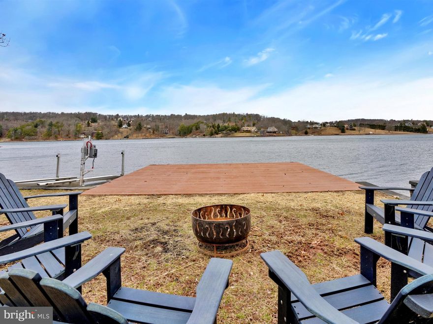 Enjoy stunning views, stellar sunsets and premier waterfront living from this magnificent 5BR/2BA 0.9 Acre Lake Wynonah lakefront! Home + waterfront feature many true advantages; newer EP Henry bulkhead, double lot with approximately 140 ft. of waterfront footage, recently stained pier and sizable, fully appointed dockhouse including kitchen, storage and covered seating area overlooking lake. Main level boasts open floor plan with hardwood flooring throughout, kitchen, 3 bedrooms and 1 full bath, living room and temperature controlled sunroom.  Gorgeous, new luxury vinyl laminate flooring in kitchen and rustic stone fireplace in living room. Bonus sunroom with plethora of windows overlooks treeline and lake views; the perfect four-season space to relax, rejuvenate and relish lakelife! Lower level offers game area, family room, covered patio, 2 bedrooms and 1 full bath + spacious utility room. All room painted in bright neutrals, welcoming a relaxed atmosphere. Detached 3-car garage accompanies home and plenty of circular drive parking. Newer improvements include: HVAC adding central heat/brand new central air, new Bosch dishwasher, kitchen sink water treatment system, new luxury vinyl plank flooring in kitchen/part of living room, new recessed lighting in lower level, installation of bulkhead in boat launch ramp area. Lake Wynonah is a gated lake community, featuring 2 gorgeous, pristine freshwater lakes (Lake Wynonah is 90 ft. deep and Fawn Lake 45 ft. deep at deepest areas). Amenities include: business office/gathering room/library, lodge w/dining and bar, social clubs, boating, fishing, wakeboarding, waterskiing, tubing, paddleboarding, tennis, pickleball, several parks/pavillion, shuffleboard, newer basketball courts, horseshoe pits, 2 pools, beautiful docks, hiking, natural wildlife and marina. Groups and events include: Active Civic Association, Dances/Concerts, Book Group, Lodge Group, Pinochle Group, Volunteer Programs, Fish & Boat Group, Exercise Classes, Senior's Monthly Dinner. Located less than an hour from Allentown, Harrisburg and Reading. Schuylkill County offers some of Pennsylvania's premier hidden gems, including Hawk Mountain Sanctuary, Crystal Cave, Lehigh Gorge Scenic Railway, Pioneer Tunnel Coal Mine, Cabela's, Anthracite Outdoor Adventure Area ( been named one of the top 10 destinations in the country for ATVs, full-size vehicles and dirt bikes. Hundreds of miles of diverse trails on 6,500 acres, combined with top-notch facilities), Yuengling Brewery, Whitewater Adventures, Hope Hill Lavendar Farm, Fighter's Heaven (former training camp of Muhammad Ali), many breweries, wineries and distilleries, state & county parks, parades, festivals, covered bridges, biking, hiking, fishing, canoeing and camping opportunities. Lake Wynonah   LIFE ON VACATION!