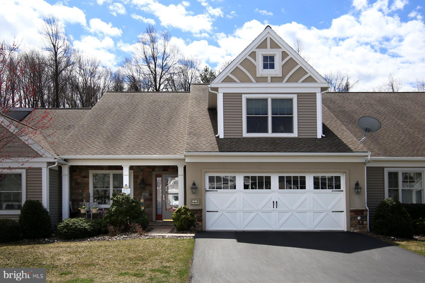 Before you step into this home you will be impressed with the detail of the inviting paver sidewalk and front porch. Inside is a wide-open floor plan with many additional features including custom kitchen with riverstone backsplash & island countertop, soft close doors, pull out shelves and cabinetry to the ceiling. 2 skylights with retractable shades and transom windows provide additional natural light to the living room with vaulted ceiling & gas fireplace. Master suite includes bath with double vanity sinks and large shower with seat. There is a private guest bedroom & bath on the 2nd floor and a conveniently located office & laundry on the first floor. All appliances stay including freezer. AT the back of the home is a lovely 3 season room with private wooded views.Economical gas heat with 2 zone heating and cooling and High/Low returns for affordable living. Membership to the 17000 sq. foot community center is optional at $300. per household per year. It offers many community activities including indoor pool, billiards, fitness center, library, morning coffee shop, craft room, bocce ball and fishing at the lake. A great lifestyle for the golden years!