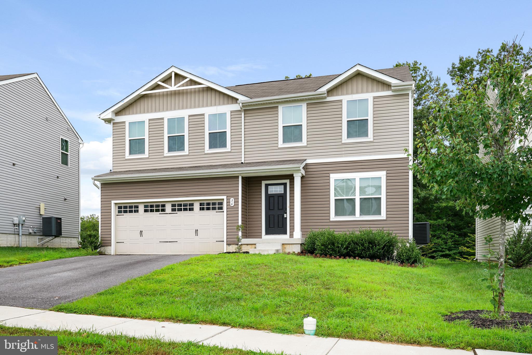 Why wait for new construction when this practically brand-new home is move-in ready? 4 Bedrooms 2.5 Bathrooms 2-Car Garage. Located in the sought-after Ridgely Forest community! Step inside to an open floor plan featuring stunning vinyl plank flooring on the main level and fresh paint throughout. Cozy up around the shiplap fireplace centerpiece—perfect for entertaining! The main level offers a versatile space ideal for a home office or guest bedroom. Upstairs, enjoy the convenience of second-floor laundry and spacious bedrooms with plush carpeting. The primary suite boasts a gorgeous accent wall, a large walk-in closet, and a beautiful ensuite bathroom. Your backyard oasis awaits—just add your personal touches to make it your own. The unfinished basement offers endless possibilities for additional living or recreation space. Entertain with ease in the kitchen that opens seamlessly to your living and dining areas—perfect for hosting friends and family! Don't miss this opportunity to own a stunning home in a fantastic location—schedule your showing today!
