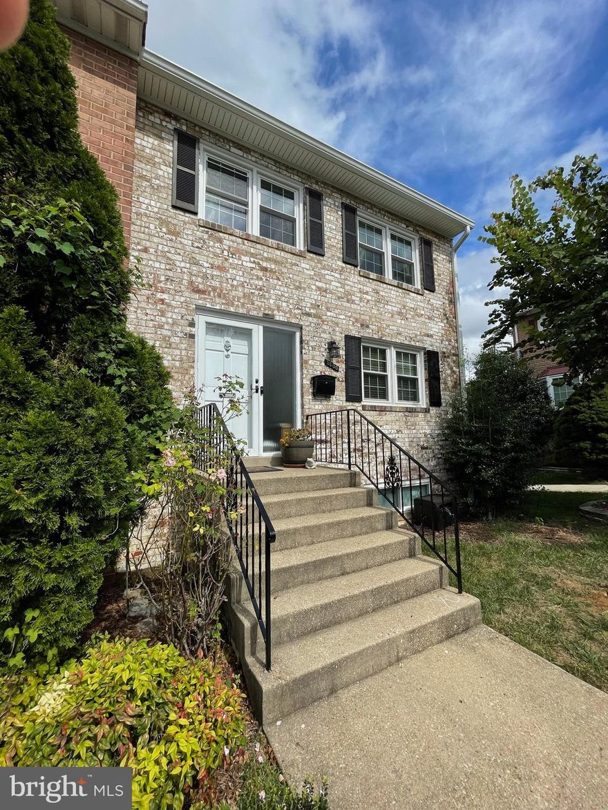 Classy, brick, end-unit townhome offers 3 levels of quality, finished living space--4 True bedrooms and 2.55 Baths.   Nestled in a private community with established trees and green space, this home still has all the benefits of the city. It is conveniently located in Falls Church just minutes to the metros, Pentagon, Amazon HQ2 and Washington D.C. It is just ½ mile to commuter biking trails (Arlington Loop) as well as wooded hiking trails and creeks at nearby Long Branch Nature Center. Multiple grocery stores, restaurants and shopping nearby. 
This open concept home is bright and spacious with new windows, hardwood floors on main and bedrooms levels and designer laminate in the entry and kitchen. Large kitchen features an island breakfast bar with bar stools, plenty of counter workspace, and abundant storage including pantry cabinetry.  Newer upgraded stainless steel appliances including refrigerator with water/ice in the door, convection/microwave and a multi burner/griddle gas range (white).  Sliding glass door opens to 2 level entertainment deck/patio below in your private, fenced backyard.  Side yard access along a concrete pathway links front sidewalk to the rear gate for easy transfer of bikes and trash/recycling bins. Dining room features an accent side window overlooking gorgeous landscaped open-space adjacent to the home.  
The upper level features an expansive master suite with spa bath, granite double vanity, incredible tile shower with a frameless door and an oversized walk-in closet. Rarely do townhomes offer this much space and storage.  Upper level also has two additional spacious bedrooms each with ceiling fans.  The hall bath is updated with decorator granite, tile flooring and shower area.  
Lower-level family room has centrally located gas fireplace with remote control, tile flooring and includes a projector with screen (can be taken down) and surround sound speaker system.  Lower level includes a carpeted private home office/4th Bedroom as well as a laundry room with new oversized washer, economical gas dryer and utility sink.  Freezer is available for tenant use.  Workbench and abundant storage with walkout to rear yard.  Additional storage in the attic space with pull down stair access.  
Community Amenities including tennis court, open space,  and dog run, 2 assigned parking spaces, as well as trash and recycling included in the monthly rent.  Home technology on the cutting edge offers optional hardwired internet in each room—perfect for working from home and/or gaming.  Apple Homekit and Alexa enabled/smart house with smart dimmer switches in most rooms plus a video doorbell and smart motorized blinds in master. TV mounts are pre-installed in the living room, primary bedroom and over fireplace.  
This home mixes location, quality and price to offer you the finest rental opportunity in the area.  Available for occupancy starting on May 23rd, Owner will consider a 2-year lease.  Pets on a case-by-case basis, good credit expected  and verifiable income required.  Please use the RentSpree application online.  Zillow applications will not be accepted.