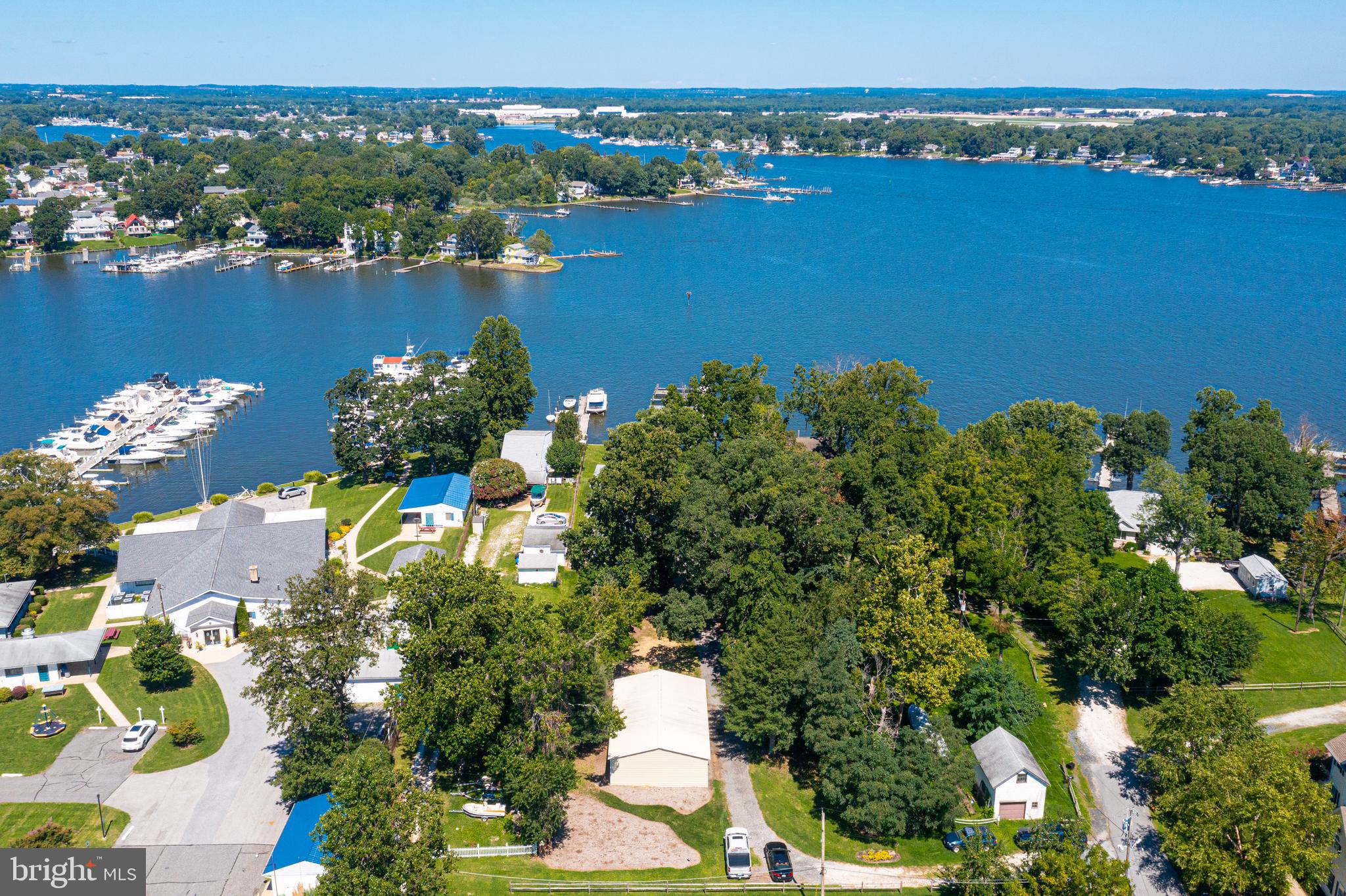 Extremely Rare Opportunity! 110' +/- Water frontage sitting on Over 1 Acre of Property with Multiple Slips, DEEP Water & Great Elevation!