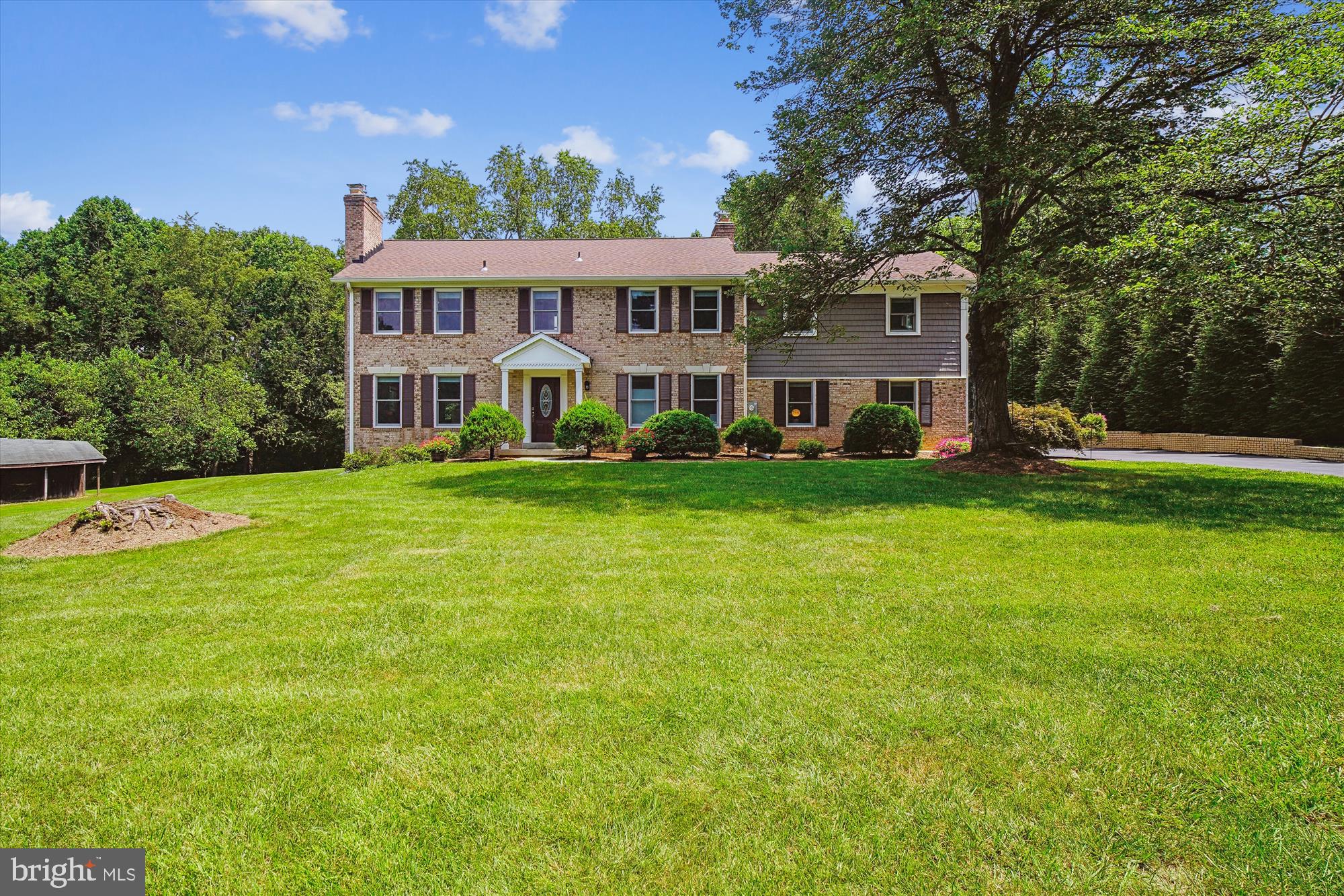 DREAM HOME ALERT!! Gorgeous 5 bedroom, 4 full bath coloniel home sitting on 2+ acres with renovations and upgrades throughout! Boasting almost 5600 total sq feet, this home sits on more than 2 acres and is surrounded by amazing views. Located in a quiet, private and serene location yet only minutes from the ICC east-west and major north-south routes. A perfect retreat AND NO HOA!!
A new front entry door welcomes you into the home where there is sparkling oak flooring! All new Anderson windows bring great light into the large, newly renovated living room. There is a fireplace for ambiance and spectacular views for serenity! This home has two primary bedrooms. One of them is an all new in-law suite on the main floor. Designed with doorways that measure a few inches wider than typical for everyone's ease of access, a walk-in closet and a spectacular bathroom with a walk-in tiled shower, pedestal sink and a modern color scheme. An all new washer/dryer room on the main floor is also included for total convenience.
You will appreciate the uniquely designed side by side gourmet kitchen and dining room! The kitchen has wood floors and a big bank of cherry wood cabinets, some with pull out drawers. There are granite countertops, stainless steel appliances including a 6 burner propane stove to make this gourmet kitchen a wonder!! There are 2 sets of new Anderson patio doors. One on the main level leading out from the kitchen to the newly installed patio just outside. The dining area has been newly designed with a unique trey ceiling and recessed lights plus an updated propane fireplace with attractive tile surround. Perfect for when guests are over. Just outside the dining room is a covered patio with lights and wiring for a fan. Just off that patio is a outside storage room making life just that much more practical.
Upstairs there are 4 bedrooms including a memorable primary with a walk-in closet and bathroom including a inviting, upgraded shower and a beautiful tub for those aching muscles. There is a sitting room/library/music room that leads into a unique and huge 22' by 22' bedroom or bonus room.
On the lower level there is a 2nd kitchen, perfect for entertaining while playing games or watching movies OR as it has its own full bath and separate entrance via the Anderson doors, turn this into an income producing apartment or a great place for friends to crash! There is a wood working fireplace and a huge utility room on the lower level for storage. Walk out of the lower level doors to a beautiful patio with perfect view of the yard!
Outside there are so many ways to enjoy this home. Use any of the 3 patios for your hot coffee mornings or for parties in the afternoon and evening. There is a barn that is excellent for storage of your equipment and is sold as is. This home is just simply amazing. Open House Sunday 7/27 from Noon to 2pm. Come see your new home!!