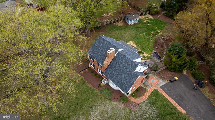 You have got to see this original Donald Lamborne Williamsburg Village classic!  Unique, charming, and breathtaking are the first of many positive adjectives that will come to mind.   You will be awestruck by a spacious kitchen featuring a modern center island/table with exotic stone that matches the countertops, as well as top-of-the-line WOLF appliances including an induction range overlooking the dining area through a pass-through.   The elegant dining room with exposed wood beams offers a feeling of serenity and peacefulness calling back to a more simple time, but in a most luxurious way.  Additionally, an inviting screened-in patio with ceiling fans offers a comfortable spot to relax outdoors and watch the ballgame while overlooking your beautiful .75 acre yard with your own decorative pond!  Moving upward, the layout unfolds beautifully: one level features a single bedroom/office as well as a family room; the next level offers two bedrooms—one serving as the primary retreat—along with a full bath; then there’s a level with another bedroom complemented by its own full bath, capped off by an additional bedroom on the top level. Notably, the two upper-level bedrooms have recently been updated with mini-split air conditioning systems for enhanced comfort.  Outside, a pristine newly sodded lawn, a convenient EV car charger, and a Starlink satellite dish to keep you connected complete this beautifully updated, one of a kind home!