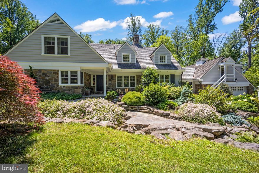 Set on 5 acres in the estate section of Villanova, this thoughtfully updated property offers a blend of comfort, space, and natural beauty. Beautifully renovated in 2014 with attention to detail, the home is designed to support both everyday living and casual entertaining.
The main residence includes a first floor primary suite, along with three additional bedrooms and two and a half baths. A spacious studio apartment located above the attached two-car garage offers flexible options for guests, work-from-home needs, or additional living space for an au pair or in-laws.
The kitchen and dining areas feature vaulted ceilings with antique wood beams and flow openly into the living room, creating a welcoming environment filled with natural light and generous proportions.
Outdoors, the landscape includes multiple terraces overlooking ponds and waterfalls providing a peaceful backdrop for dining, gathering, or enjoying quiet moments. The property is home to perennial and herb gardens and has been reforested with a variety of native trees and shrubs, offering visual interest throughout the seasons. A walking trail weaves through meadows, wooded areas, and over small streams, making it easy to enjoy time in nature without leaving home.
Set slightly apart from the main residence, a saltwater pool and spa are surrounded by plantings and a stone wall, creating a private area for warm-weather enjoyment.
This property offers a unique opportunity to enjoy a quiet, natural setting while remaining close to the amenities of the Main Line and Philadelphia. Contact us to arrange a private tour.