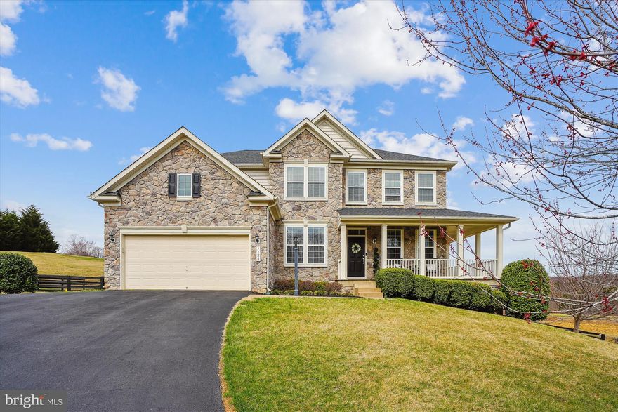 Welcome to this stunning five-bedroom home located on the sought-after DC side of Warrenton, where charm and elegance greet you from the moment you step onto the wrap-around stamped concrete front porch. The main level features an open layout highlighted by a gourmet kitchen with a large island and a butler's pantry, perfect for entertaining. A cozy office space complements the living area, which boasts a gas fireplace and beautiful hardwood floors that elevate the home's sophistication. Upstairs, the expansive primary bedroom serves as a private retreat, complete with bathroom featuring a soaking tub, double vanities, and a generous walk-in closet, alongside three additional spacious bedrooms and a convenient laundry room. The finished walk-out basement adds even more appeal with an additional bedroom, full bath, recreation room with a bar, and a theater room—ideal for relaxation and entertainment. Outside, the backyard is an outdoor oasis with a deck leading to a large patio, with outdoor kitchen bar with granite countertop perfect for gatherings, all within a fenced yard. This elegant home seamlessly blends style, comfort, and functionality, making it an exceptional choice for anyone seeking the best in Warrenton living. Roof and water heater approximately 1 year.