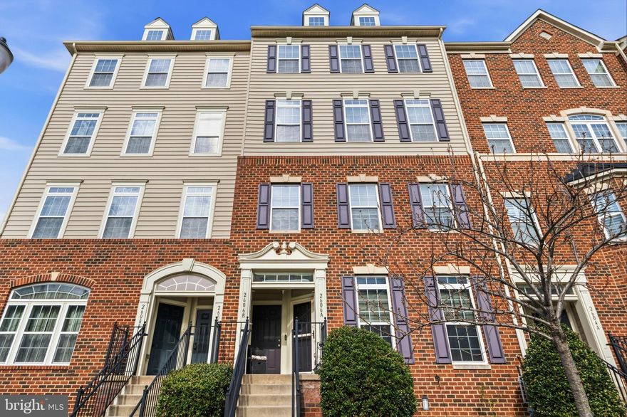 Beautifully appointed two‑level condo in the sought‑after Market Square community. The main level features an open‑concept layout ideal for both everyday living and entertaining. Enjoy a bright living room, a formal dining area, and a cozy family room with a gas fireplace. The kitchen is a true standout, showcasing stainless steel appliances, granite countertops, a double wall oven, and a large island with seating—perfect for cooking or gathering. Step out onto the balcony to savor crisp spring mornings or unwind at the end of the day. The spacious primary suite offers elegant tray ceilings and a generous ensuite bath complete with a soaking tub. Two additional bedrooms, a full hall bath, and the convenience of upper‑level laundry round out the private living space. Parking is effortless with a one‑car attached garage and a two‑car parking pad. The amenity‑rich Market Square community offers trails/paths, tot lots, a community pool, and unbeatable proximity to shopping, dining, and major commuter routes. This home truly has it all.