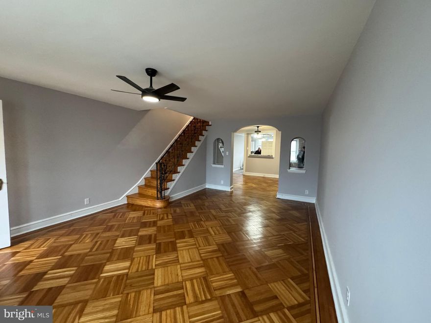 COMING SOON -3/30/25  SHOWINGS START AT OPEN HOUSE  FROM 12 PM to 2 PM. Don't miss this large 1404 Sf  West Mayfair Chippendale Model stone castle front straight- through. Enter through a air lock foyer door to a beautiful living room with refinished parquet inlaid crafted floors to a generous sized dining room  with an open pass through  bar  counter to a large remodeled eat in kitchen featuring a brand new stove and microwave and a high end  Boesch dishwasher accented by a lovely granite countertops.  The first floor is AC is furnished by a large unit in the dining room and 3 ceiling fans.  Climb the refinished stairs with a decor wrought iron railing to 3 generous sized bedrooms, also with beautiful refinished parquet inlaid floors. The three piece hall bath features a seperate stall shower and full tub and a antique stain glass opening skylight. Enjoy the finished family room with luxury durable vinyl  floors, a full bath, utility room with extra storage, laundry room and a ground level exit to the rear driveway and  garage.  The entire home has recently been repainted . H2O tank replaced 11/20/23 Furnace replace 12/21/16. Roof coated 2024. Replacement windows where shown.