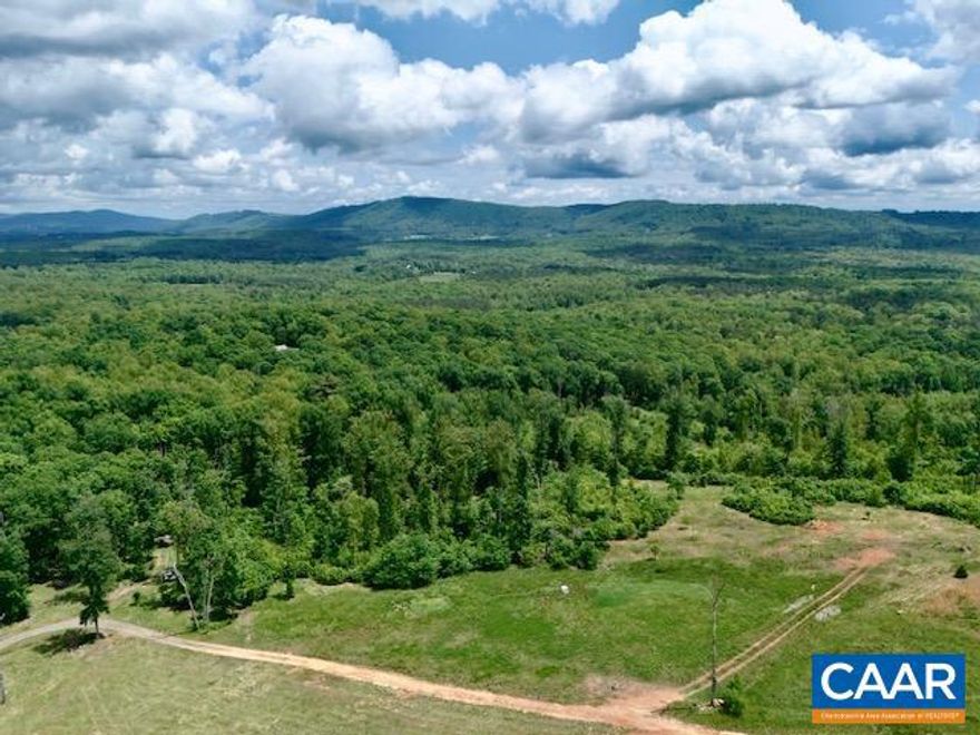Discover the perfect canvas for your dream home on 7.35 acres in the heart of Albemarle County. This unique property offers stunning, panoramic mountain views in every direction ? the kind that make you feel like you?re truly on top of the world. Whether you?re enjoying your morning coffee or watching the sun set, the vistas here are nothing short of extraordinary. Enjoy walking trails that cross through wooded areas and there's a year round ACTIVE SPRING on the property as well! Though it feels like a peaceful escape, you?re just under 5 miles to Wegmans and all the conveniences of Charlottesville living ? the best of both worlds. This rare find in Albemarle combines natural beauty, privacy, and accessibility, making it an ideal setting for a custom retreat or forever home. Don?t miss your chance to own a piece of paradise. There's nothing like experiencing the view for yourself ? it?s even better in person.
