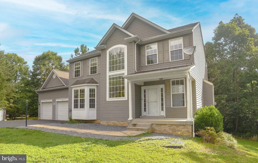 Check out this wonderful 3 story colonial in Riverside Farms sitting on over 2 acres. Riverside Farms runs along the St. Mary's River and offers water access. The community pier and canoe/kayak launch along with the massive athletic field and playground is perfect for a relaxing and fun day with family and friends. Open the front door and walk into your 2 story foyer. The main level has hardwood floors, an open kitchen/living room with hardwood floors, granite countertops, stainless appliances, pantry, plenty of cabinets and counter space, center island, and gas fireplace. The formal dining room with an abundance of natural light features crown molding and chair rail. You will also find your 1st of 2 laundry rooms here. Upstairs you will find your very generously sized primary bedroom and bathroom with soaking tub, separate shower, double vanity, laundry shoot, and huge walk-in closet large enough to fit all the things! There are  3 additional bedrooms and a full bath upstairs. Fully finished basement set up as an in-law suite with full accommodations to include a 2nd kitchen, living room, large bedroom, full bath, and 2nd laundry room with a walk-in closet. NEW carpet and paint. Ceiling fans and blinds throughout. There is plenty of room for children or pets outside to run and play. Plant a garden. Entertain on the large deck backing to trees to allow privacy. Newer shed with double doors to hold your riding mower and other items with ease. The 2 car garage and paved driveway allows room for plenty of parking, bring your RV and boat. So much to offer on this one!