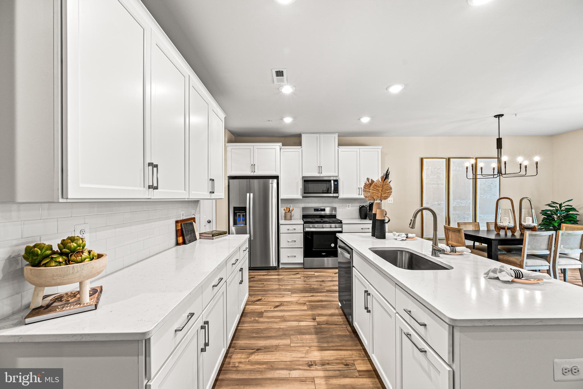Just listed, the Avery Model Home at Clover Mill ready for immediate move in! The Avery floorplan, a 3 BR, 2 Full, 1 Half Bath, 2-car garage home offering a versatile home designed for modern living. The open layout seamlessly combines living, dining, and kitchen areas. The kitchen features 42" cabinets, subway tile backsplash, and quartz countertops. The great room extends to a deck for outdoor living. Upstairs, the primary bedroom offers privacy with an en-suite bathroom and extra-large closet. Laundry on this level adds convenience. Two additional bedrooms with walk-in closets can double as home offices. Located in the new Clover Mill community by Lennar, within the sought-after Downingtown School District with a STEM Academy.
