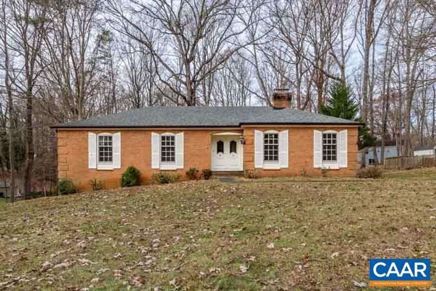 Opportunity awaits - Don't miss your chance to view this carefully conserved ranch located near the heart of Charlottesville. Expansive corner lot spans nearly an acre, so you have plenty of room to grow while still maintaining privacy. This property is priced to sell, (as-is and under tax assessment), so you can create your own vision of home in this picturesque and charming setting!,Formica Counter,Wood Cabinets,Fireplace in Basement,Fireplace in Den,Fireplace in Kitchen,Fireplace in Living Room