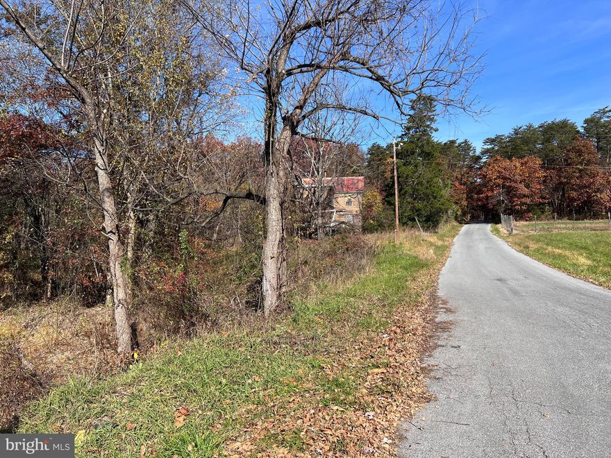 5 ACRES - Situated along a state maintained road.   This property will make a good building site for your new home.  (old home is no value)  DO NOT ENTER PLEASE.   Parcel being sold as is.
