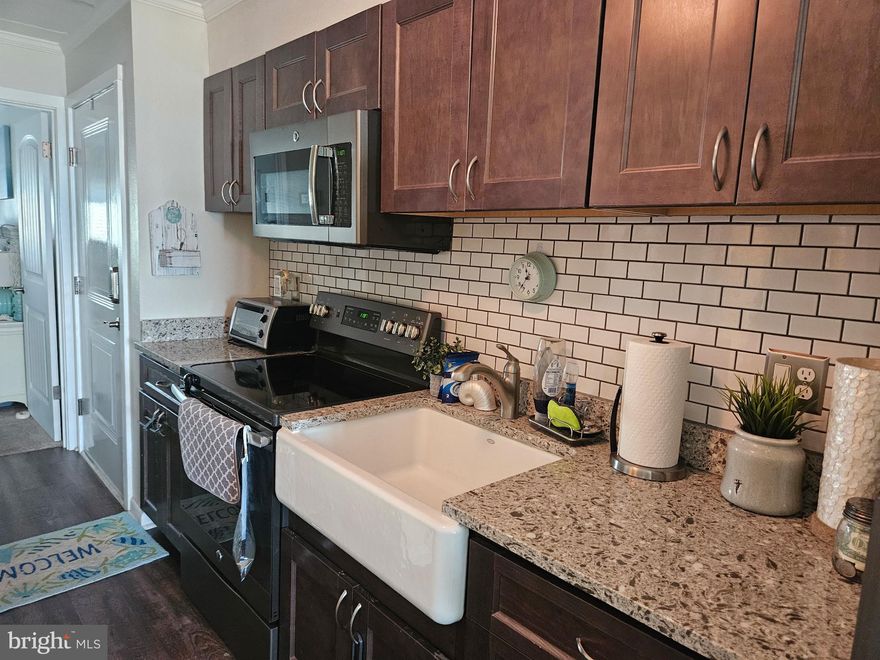 Immerse yourself in the ultimate coastal lifestyle with this breathtaking oceanfront retreat. Just steps from the soft sandy beach, this beautifully designed 1 bedroom, 1.5 bath is a haven for relaxation, family bonding and sensory delight. From the moment you enter you're greeted by charming board and batten walls that add architectural flair. Luxury plank flooring in the living and dining area. Plush carpet in the bedroom. The open floor plan is adorned with elegant crown molding. The kitchen has been updated. 
Step outside to your private balcony and let the panoramic ocean views captivate your senses. Hear the waves crash, feel the salty breeze and watch the sun dance.
Whether you're making cherished family memories, enjoying a romantic getaway or simply unwinding this residence delivers an experience that appeals to every sense. Don't miss your chance to own a slice of paradise!