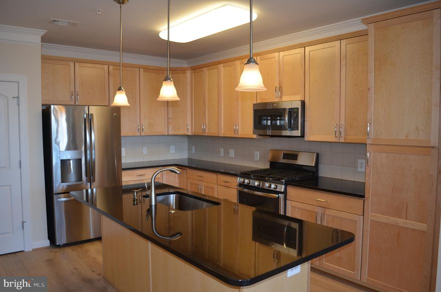 This spacious condo features an open floor plan with chef's kitchen, oversized windows in the living area ushering in loads of natural sunlight, an outdoor patio space in a private setting, 2 large primary suites and loads of closet space. Garage parking space included in rent. Washer/dryer in unit.