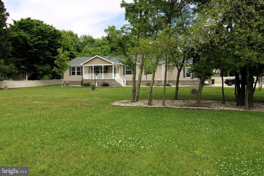 This charming property features both a lovely home and versatile business spaces on two acres. The home includes a living room with a tray ceiling, indirect lighting, recessed lights, and crown molding. The kitchen boasts stainless steel appliances, a gas stove, a center island that doubles as a breakfast bar, a tile backsplash, a large stainless steel sink, recessed lighting, crown molding, and a corner walk-in pantry.

The home is equipped with a sprinkler system throughout and crown molding in every room. Beyond the house, the property offers impressive outbuildings. The smaller building, approximately 24' x 40', is perfect for a mechanic or someone in car repairs, detailing, or painting. It includes a compressor with air lines, a fan, heating and air conditioning, and a finished interior.

The larger building, measuring 40' x 30', is much taller to accommodate large equipment for various business needs. Whether you run a plumbing service, metal shop, woodworking business, carpentry, construction company, workout gym, yoga studio, or photography studio, this property suits your needs—except for manufacturing or a gun shop. Your business is conveniently located at your home but completely separated by fencing.

The home also features a fully screened porch, including under the flooring, measuring approximately 22' x 14', and an outdoor patio perfect for enjoying the sun. There's ample space to add a pool, making this versatile property even more magnificent.