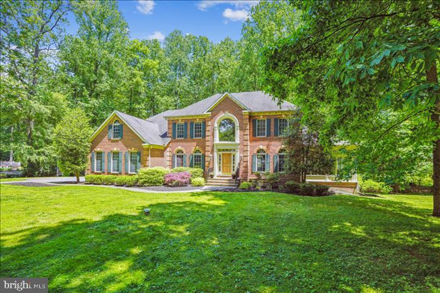 Price Improvement!  Beautifully maintained spacious 4 bedroom, 4.5 bath brick colonial nestled on a gorgeous 1.52 acre wooded lot on a quiet cul-de-sac. A  dramatic two-story foyer with a grand staircase welcomes you to this impeccable home with inviting gathering spaces.  The main level features a formal dining room, living room and dedicated office with custom built-ins, powder room, laundry/mud room and sizable bright sunroom.  A large eat-in kitchen with new Quartz countertops opens to the family room with gas fireplace, all feature floor to ceiling windows allowing beautiful natural light and views of the private wooded back yard.  A brand new Fiberon bi-level deck with solar lights creates a wonderful outside ambience and allows for additional entertaining space.  The three car garage has generous space along with slat walls throughout for extra storage.  Home warranty provided.

The upper level includes an incredible large primary bedroom suite with a cathedral ceiling, sitting area, two walk-in closets and ensuite bath with large sunlit windows.  The roomy second bedroom features an ensuites bath and walk in closet.  The third and fourth bedrooms are sizable and include a Jack and Jill  bathroom.  

The lower level is fully finished and is a massive space capable of accommodating both an ping pong table and a pool table, a separate room for either another bedroom or office, a full bath, exercise/weight room and storage room including a cedar closet.  Freshly painted with brand new carpet throughout makes this open floor plan great for entertaining.  This home is Move-In ready!!!!   **House was measured  and the estimated square footage for the entire home is 7350 square feet**