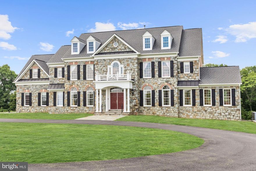 New Price! Elegant, stone & brick colonial w/9,200 sf of finished space on pastoral 2.49 acres. Built by Craftsmark, home shows like new construction and features numerous upgrades. Among the home's features are: chef's kitchen w/Viking stove, Sub Zero refrigerator, Great Room w/floor to ceiling windows and gas fireplace, fully equipped Media Room. Too many features to list. Open July 1.