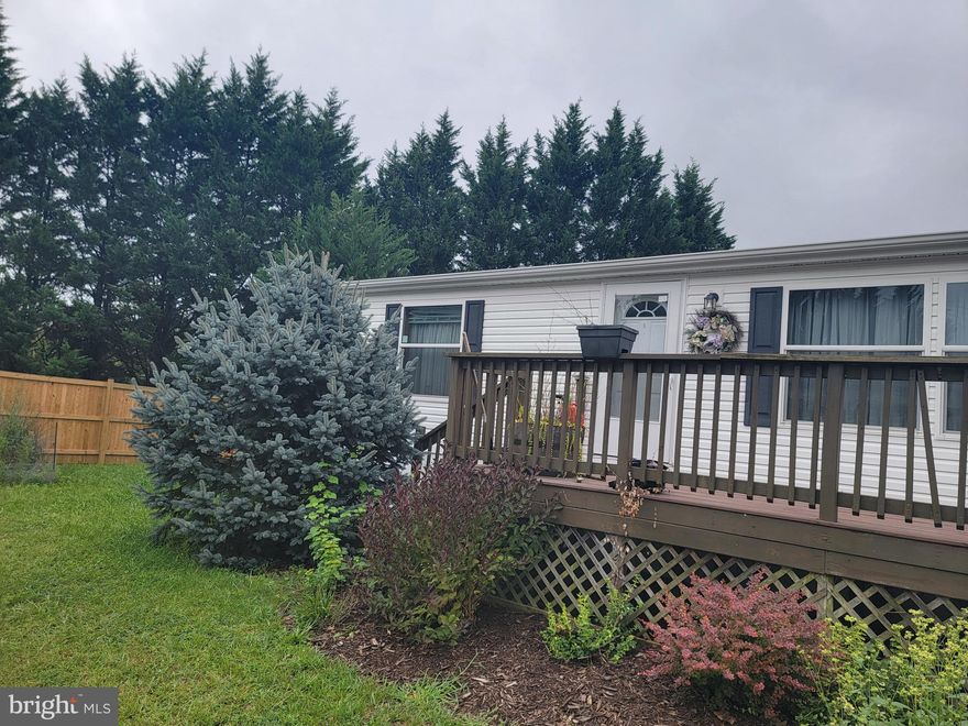 Check out this beautiful double-wide manufactured home! With three bedrooms and two baths this is the perfect starter home, or retirement home. Sitting on a rented lot in the Grapevine Village for $490/month this beautiful home is easy to take care of. This home features a shed, small deck out back to enjoy these fall days coming, and backs up to a community fence! Come take a look today!