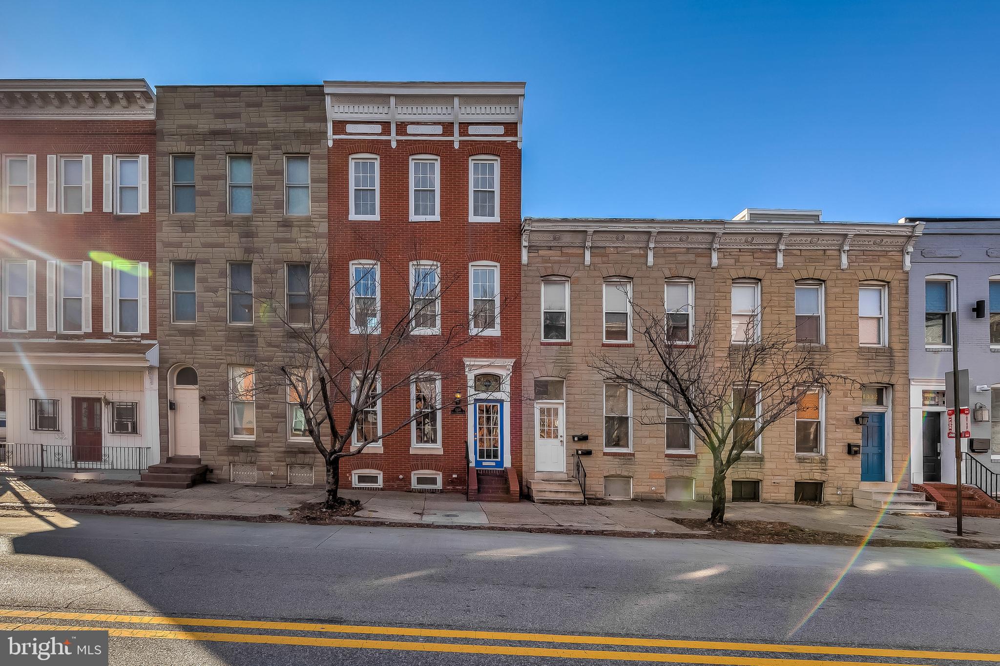 Home was appraised by a certified Fannie Mae appraiser on 1/13/2021. Home is listed at appraised value. Meticulously and lovingly maintained historic 4 Bedroom/4.5 Bathroom townhome in the heart of sought after Federal Hill. Enjoy all the possibilities of this very spacious and wide 4 level home that is full of Old World Charm! It features the original ornately carved grand stairwell, impressively high ceilings, generous over sized rooms, fine craftsmanship and exposed brick throughout. The Master suite contains a Jacuzzi tub and standing shower, along with a wet bar off of the deck for those weekend gatherings on the roof top deck overlooking the city with a 360 degree view from the hot tub! This home features wood floors throughout, stainless steel appliances, granite counters and a Bosch dishwasher in the kitchen. Never stress trying to find parking, as it also includes a 1 car parking pad in rear, conveniently off of the kitchen. Around every corner is a spacious closet with more than ample storage, and plenty of rooms to create 2 home offices! The finished basement contains 2 rooms that could be a second family room plus a bedroom, along with a full bathroom. This very quiet, charming, and extremely walkable home is located close to Cross Street Market, Downtown, Stadiums, I-95, and all the restaurants, cafes, and nightlife you could imagine.