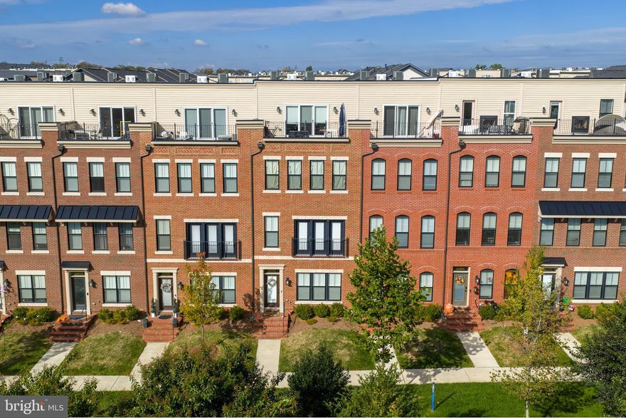 Experience modern elegance and convenience in this beautifully appointed four-level Knutson-built townhome offering approximately 2,800 square feet of living space, designed to combine luxury, comfort, and functionality in Brambleton - one of Loudoun County’s most desirable communities. Step inside to find a spacious open-concept main level highlighted by hardwood floors, beautiful lighting, and oversized windows that flood the home with natural light. The chef’s kitchen is the centerpiece, featuring stainless-steel appliances, quartz countertops, a large island with seating, and modern soft-close cabinetry—perfect for gatherings or quiet evenings at home. The primary suite offers a relaxing retreat with a spa-inspired bath, walk-in closet, and generous proportions that reflect thoughtful design. Two additional bedrooms, each with access to a full bath, provide flexibility for family, guests, or home-office use. The upper-level loft serves as a retreat and entertainment space, opening onto a rooftop terrace ideal for morning coffee or evening sunsets. The lower level features a versatile recreation room and half bath, creating an excellent option for a guest suite, media room, or gym.
Enjoy the ease of a two-car garage, low-maintenance exterior, and an exceptional suite of Brambleton HOA amenities, including high-speed internet and cable TV, trash and recycling services, five outdoor pools, miles of walking and biking trails, numerous parks, and an active calendar of community events and programs—all designed to enhance everyday living in this vibrant neighborhood.

Nearby Attractions:
* Brambleton Town Center – 0.3 miles
* Hanson Regional Park – 1.8 miles
* Beaverdam Reservoir – 3.4 miles
* Dulles Landing Shopping Plaza – 4.7 miles
* One Loudoun – 6.9 miles
* Dulles International Airport (IAD) – 7.3 miles
* Silver Line Metro – Ashburn Station – 5.6 miles
* Ashburn Recreation Center – 3.2 miles
Make an appointment today to check out this wonderful home!