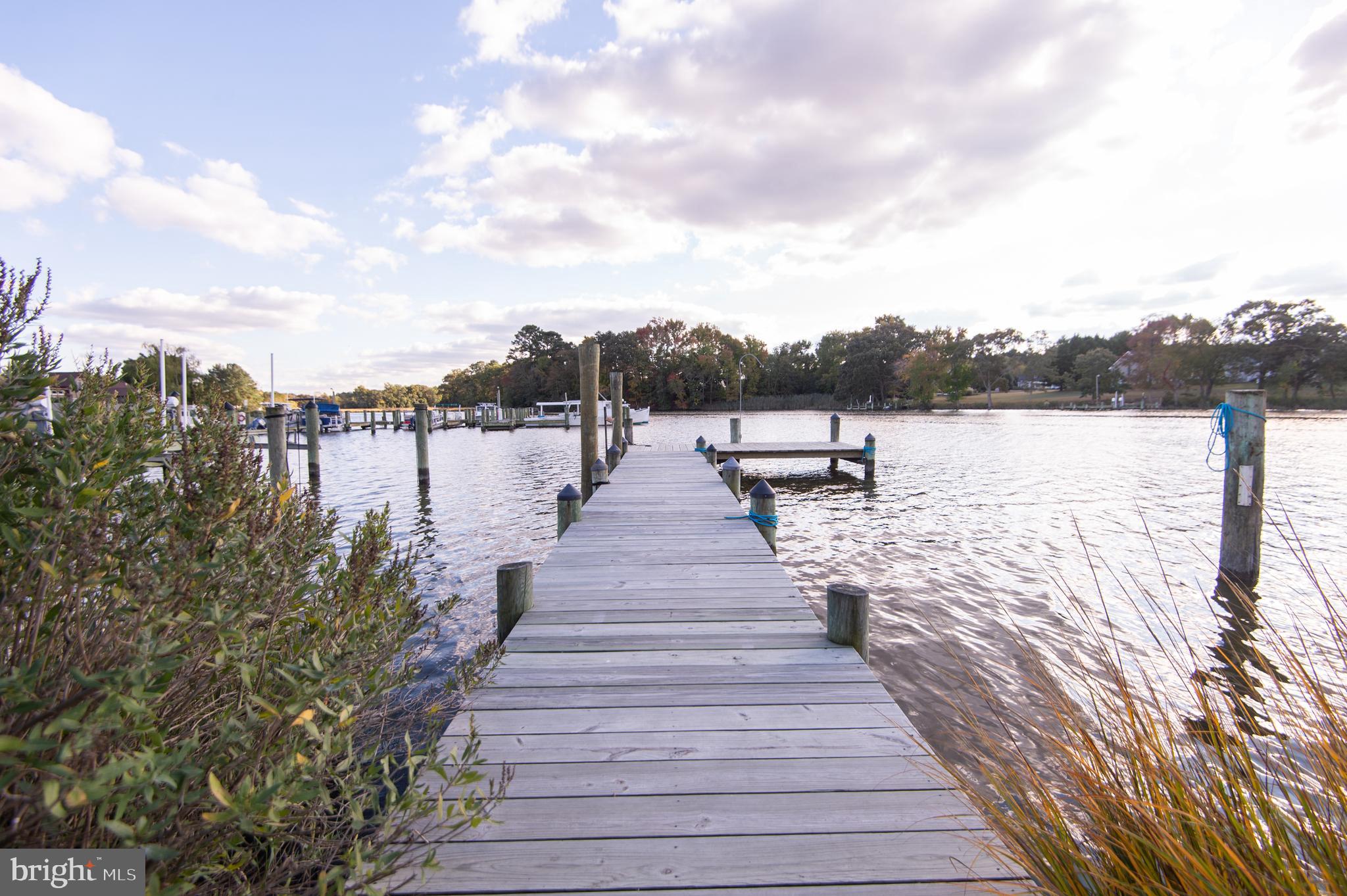WATERFRONT GEM on the Warwick River!
Nestled in the charming, water-oriented town of Secretary, this beautifully renovated 3-bedroom, 2-bathroom home offers the perfect blend of modern comfort and Eastern Shore charm. Renovated in 2021, the home boasts a stunning kitchen with river views, a spacious island, granite backsplash, premium Kitchenaid Café appliances, a drawer microwave, and a built-in wine cooler—ideal for entertaining.
Just off the kitchen, you'll find a generous butler’s pantry/laundry room with ample storage and a utility sink for added convenience. The living room invites you to relax, featuring a sliding glass door that opens to a large deck—perfect for seamless indoor-outdoor living.
Upstairs, the primary suite is a true retreat with cathedral ceilings, an en-suite bath, and breathtaking water views—best enjoyed from the private balcony.
Step outside and enjoy the waterfront lifestyle with an "L"-shaped dock (new decking and stringers in 2022), offering three boat slips (approx. 3’ MLW), space to lounge, and front-row seats to birdwatching and natural beauty.
NO flood insurance required and conveniently located—just a short drive (or boat ride!) to Cambridge or Easton, and under 30 miles to Salisbury.
Don't miss this rare opportunity to live the waterfront dream on Maryland’s Eastern Shore!