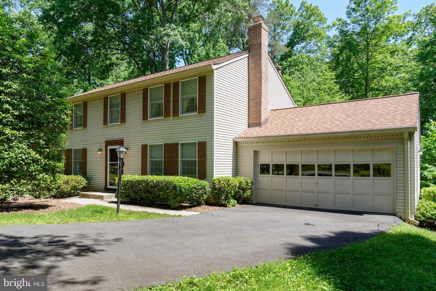 COLONIAL LOCATED ON WOODED HALF-ACRE. AMAZING FOOTPRINT FOR YOU TO MAKE YOUR OWN. FIRST FLOOR FEATURES SPACIOUS LIVING, FAMILY, DINING ROOMS AND EAT IN KITCHEN. GENEROUS SIZED BEDROOMS W/HARDWOOD FLOORS ON SECOND LEVEL. BASEMENT FEATURES LARGE RECREATION ROOMS AND STORAGE SPACE. BEAUTIFUL NEIGHBORHOOD W/AN OASIS OF WILDLIFE & PRIVACY.CURRENT YEAR SCHOOLS: HUNTERS WOOD ELEMENTARY, HUGHES MIDDLE SCHOOL, AND SOUTH LAKES HIGH SCHOOL.