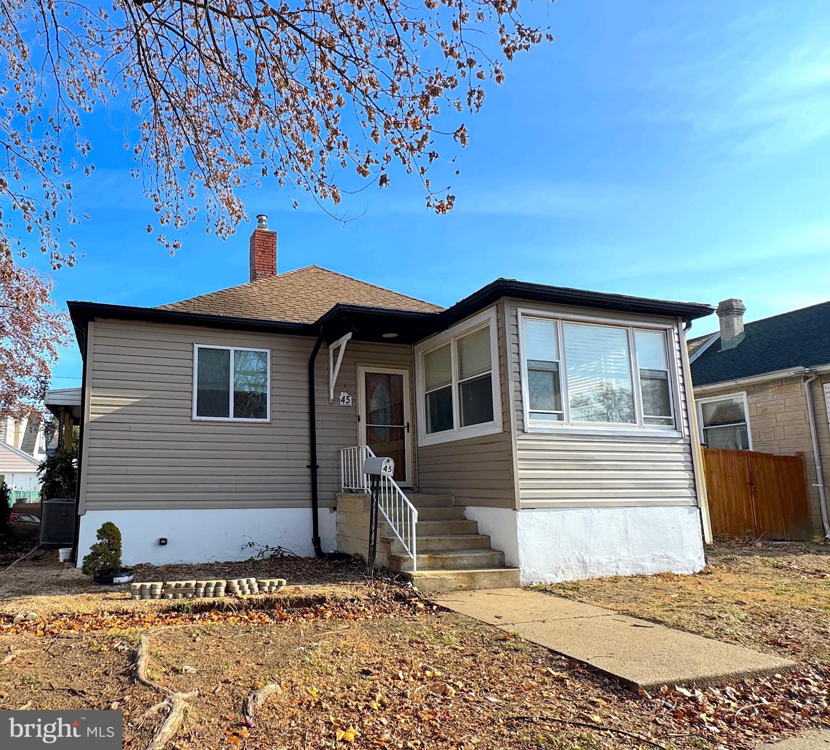 Welcome home to 45 Broadship Road, an updated oasis for every day life. As you walk into the front door, be welcomed in by an electric fireplace, a large living area to an open kitchen with updated appliances, cabinets, and island. Enjoy quiet and serenity in three main level bedrooms, a full bathroom, the back bedroom featuring a large loft area for your choice of custom use. Outside, you will find an expansive stamped concrete patio, fresh poured concrete landing pad off of the back stairs, oversized newly sealed driveway, and double gate for ease of use. This home boasts many updates and renovations to include updated bath and kitchen, a tankless water heater, modern and updated washer and dryer, new HVAC unit, new vinyl siding, new carpeting in the loft and back bedroom, and updated basement waterproofing features this seller spared no expense! Make it yours today!