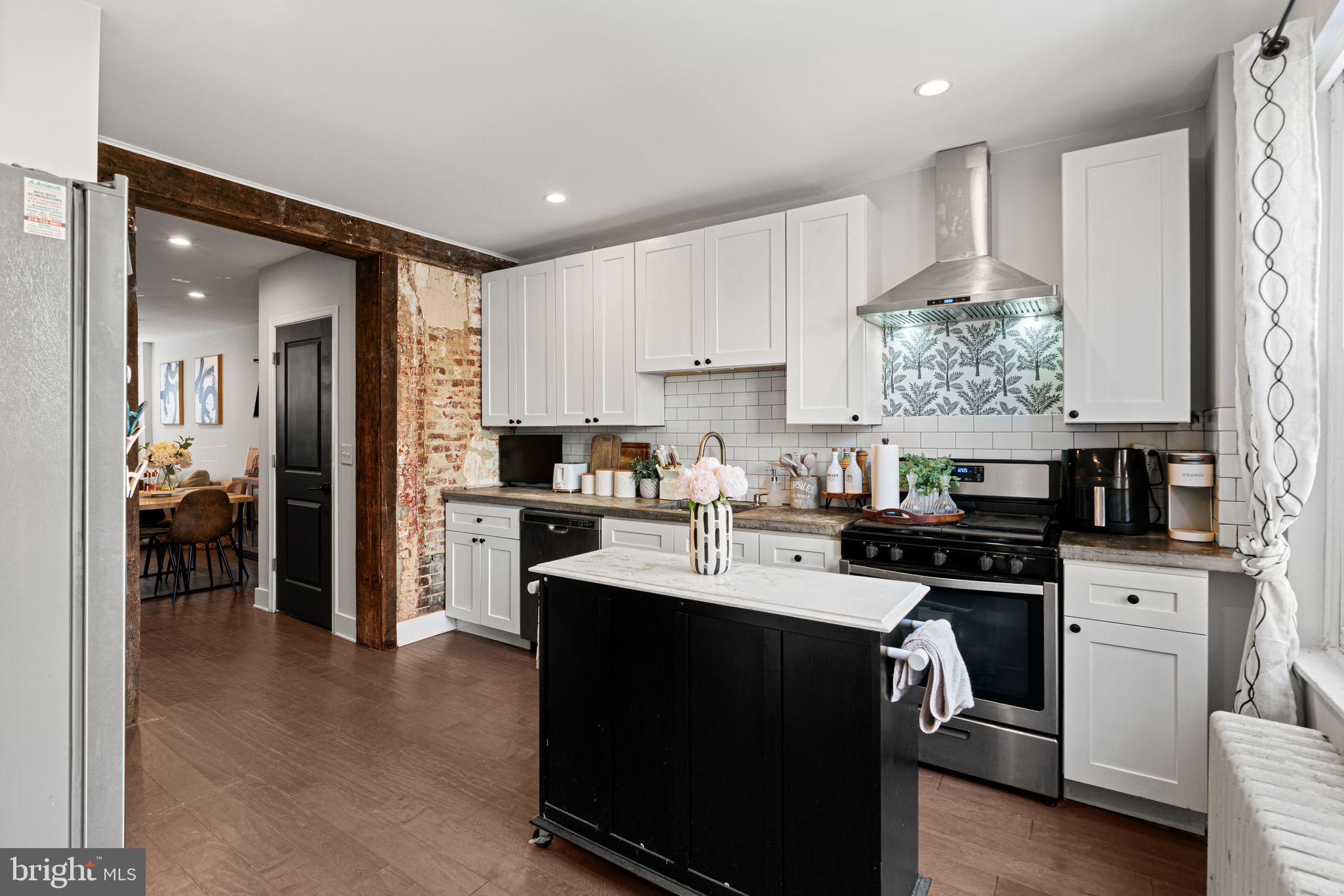 This renovated charming rowhome is quietly tucked away on Sears Street with Wharton Square Park in view. RENTER INCENTIVE: 1 mo. free with 22+ month lease term. First floor offers contemporary palette w. a generous open floor plan & hardwood floors. Living & dining areas lead to a brick exposed entryway to the kitchen. Kitchen has bright white cabinets, stone countertop and stainless steel appliances with room for an eat-in area, and a beautifully enclosed private backyard, perfect for dining al fresco and entertaining. Second floor has a spacious primary bedroom w. two guestrooms, one of which is currently used as a guest bed/ office and the other as a walk-in closet w. built in bookshelves. Full bathroom has subway tiled soaking tub w. sink and vanity. Walking distance to University City, CHOP, local eateries 22nd Street Cafe & El Mezcal Cantina, local grocery stores including Giant Heirloom grocery. A new one mile bike path just opened up connecting Grays Ferry to Schuylkill River trails & boardwalk, near South St Bridge, Schuylkill River Park, Dog Run, Community Garden and more.