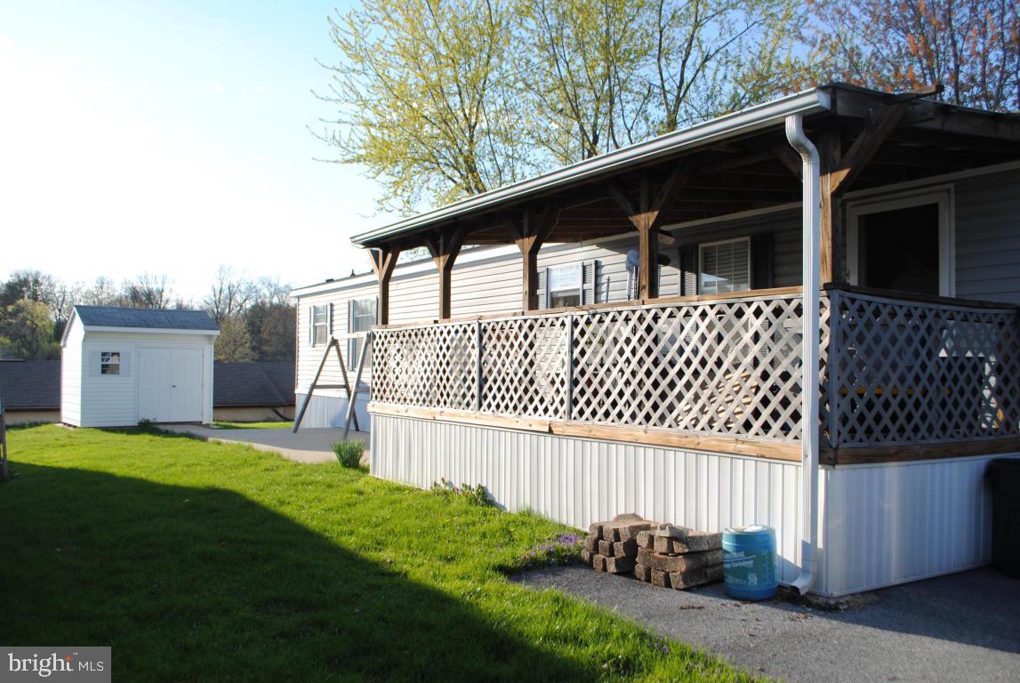 Bright & Spacious singlewide! Enjoy covered porch, sunny backyard and cement patio. All appliances stay. 2005 Colony 16x72 with handicap ramp access. Master bedroom has huge walk-in closet. Master bath has garden tub and walk-in shower. Floorplan offers a Bed/Bath at opposite ends for privacy. Rules allow 2 big dogs. Walk to open space (30 acres) and pond fishing! Parking available for RV/boats and storage units at park entrance. See 29 pics!