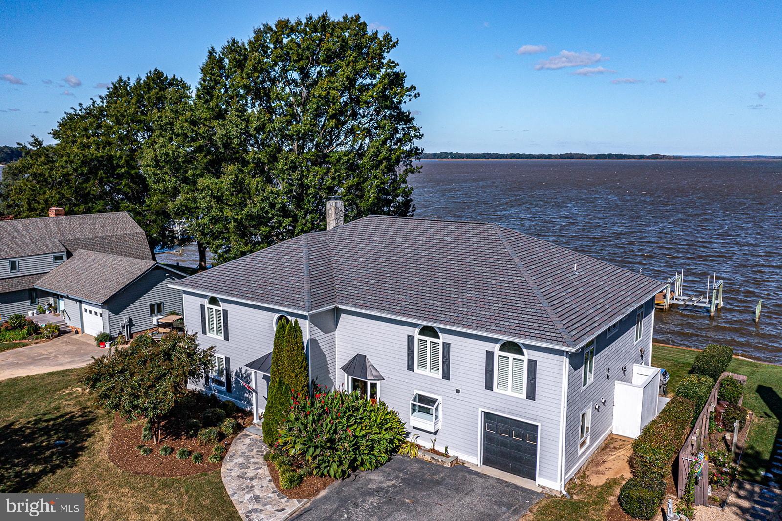 Wide open water views and tons of room for guests make this Rappahannock river getaway a must see. Located 4 miles from Tappahannock and only about an hour away from Richmond or Fredericksburg. This property has it all! Three boat lifts for all your water toys. Vinyl Bulkhead in place for years of protection. Sand beach at low tide with access a stones throw away to a community boat ramp. Home features 4 Bedrooms with 4.5 baths an office a workout room and 2 enclosed porches for enjoying the sunrises and sunsets. A clean dry basement for storage and possibly a wine cellar. Large owners suite with walk in closet and laundry upstairs. Located in a quiet very desirable neighborhood. These don't come available often! Make your appointment today.