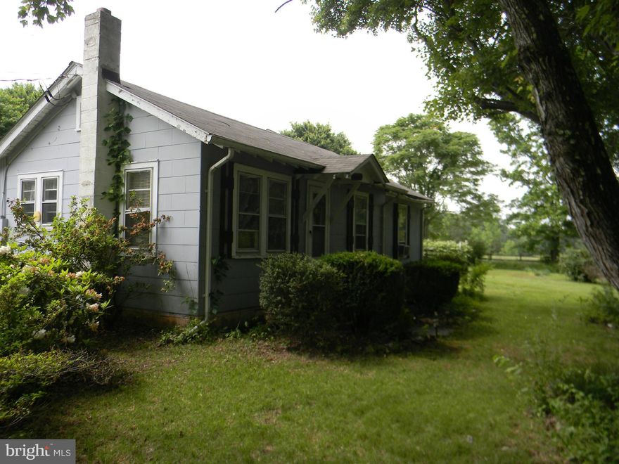 Seller says SELL!  12 PLUS ACRES!  Bring the horses!  Great property to have horses. Fenced and ready to go. Barn with stalls and paddocks in place. 3 sheds. Pond on property. Great investment. County says you can build on 3 acre lot once a year. New roof. New well pump. All pipes have been replaced. Pull down attic stairs. Laundry/mud room. Year built is estimation.