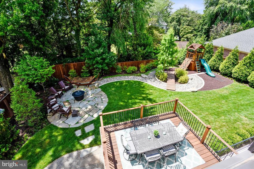 Welcome Home!   Situated on a level 10,000 sq ft lot located in a friendly North Arlington neighborhood, this exceptional residence will exceed your expectations inside & out! Greeted by lush landscaping and spacious tea-sipping, covered front porch.  Step in to find an open floor plan with no detail overlooked. Every finish was intentional and well thought out to provide the utmost functionality providing tremendous value. Purchased from highly sought after local builder (Classic Cottages) in 2016, the owners have truly made this house a stunning home! Craving more outdoor space these days? You will love relaxing on the gorgeous Cumaru Brazilian Teak deck with retractable awning, gathering around the Cooke custom 60" fire pit (on order-what you see in the photos is a place holder), or chasing fireflies while enjoying the professionally designed green space.  Spending more time at home? You will be pleased to prepare meals or host gatherings here! Custom Soft-Close Cabinetry adorned w/ champagne bronze hardware   2 sinks, one on the expansive island & the other perfectly placed to overlook the amazing backyard   Thermador Pro Series Stainless Steel Appliances including: 6 burner Gas Range w/ 36" Zephyr Hood, additional Wall Oven, built-In Microwave, built-in Refrigerator & whisper quiet Dishwasher   Gas Stone Fireplace & Hearth   Breakfast Nook   Butler's Pantry   Island Seating for 4   Walk-in Pantry   Mud Room just off of the heated garage w/ epoxy floor   Grand Owner's Suite w/ Tray Ceiling, Beautiful Treetop views, Spa-like Bath & 2 Walk-in Closets   Formal Dining Room   Main Level Bedroom   Expansive Walk-up Lower Level to use as you please including Office/Gym space, Au Pair/In-law Suite & Storage Galore   Global Wifi remote-controlled 12 zone irrigation system   Recessed &  Custom Lighting throughout, Custom Painted Outlet Covers to blend in with the Kitchen Backsplash, LED Backlit Street Numbers   Quality construction with Hardie-Plank siding & shake, 6" gutters, Bronze Windows, Craftsman Entry Door w/ side sash lights, Pennsylvania Blue Slate Flagstone Patio & Porch w/ wrought iron railings, Porous Paver walkway & driveway, wrap around exterior lighting, designer garage Doors, Jeld-wen windows   Architectural Asphalt Shingle Roof   Freshly painted interior   Pristine hardwood flooring   As if the house was not impressive enough, please note the following conveyances: Custom Ethan Allen Rugs in Hallways, Custom Rugs in Primary sleeping space & bath, Formal Living Room   Custom Draperies   Blinds   Curtain Rods and Room Darkening shades throughout the entire house   Owner's Suite and Great Room Wall Mounted TV's   Lower Level Office Bookcase   Fire pit   6 Adirondack chairs   Hammock   Storage Room Shelving   Deep Freezer   Creative Playthings play set custom stained to match Deck, Fence, Gates & Bridge   Professional grade sound system utilized on Lower Level, Main Level & Backyard   Tree-lined street w/double sidewalks   Convenient to METRO, I66, GW Parkway, I495,  numerous top-rated schools, community pools, Washington Golf Country Club, retail, restaurant, nightlife, airports, DC & beyond! There's No Place Like, HOME! Please copy and paste property walk through video link if you are unable to find on site:   https://www.youtube.com/watch?v=GMN0LabEUHE