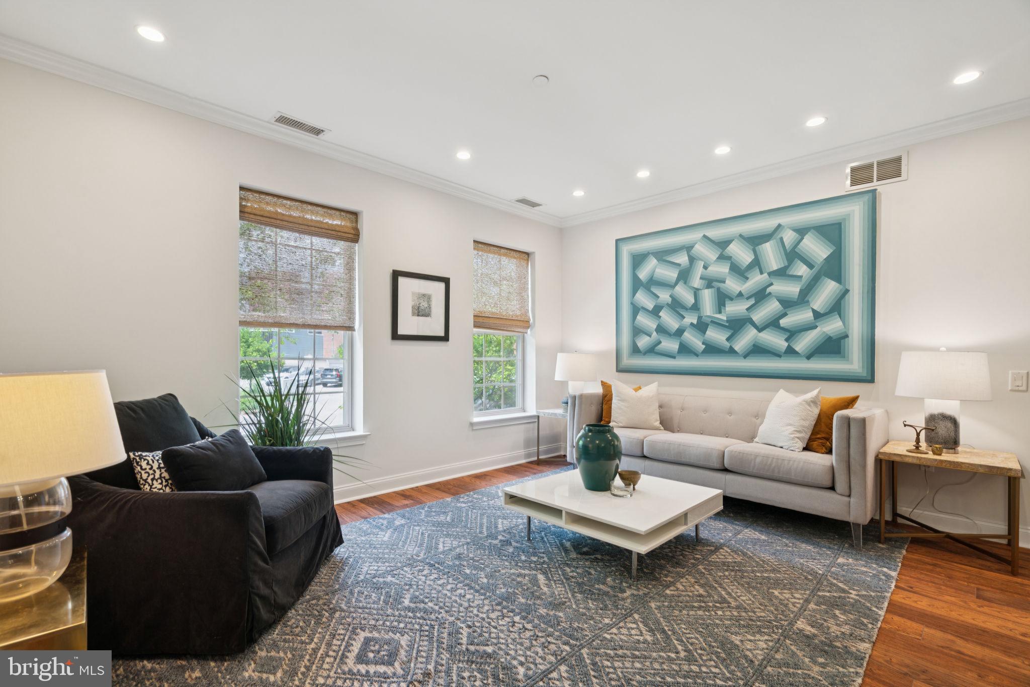 Spacious and beautifully maintained, this two-bedroom, two-bath condominium in Naval Square offers modern living with a highly desirable split floor plan and DEEDED PARKING. Located on the first floor of Strickland Court, Unit #110 is just steps from the building’s entrance—providing unmatched convenience—yet offers a peaceful retreat with the best of city living just outside the gates. Inside, the open-concept layout is designed for both comfort and style. The gourmet kitchen features granite countertops, stainless steel appliances, a full-size pantry, and abundant cherry cabinetry. A large center island with a breakfast bar is ideal for casual meals or morning coffee. Upgraded wide-plank hardwood floors flow seamlessly from the kitchen into the spacious dining area—perfect for entertaining with overhead lighting and room to seat a crowd—and continue into the sunlit living room, where two oversized windows fill the space with natural light. The king-sized primary suite is a true sanctuary, offering a walk-in closet with custom built-ins and a spa-like ensuite bath complete with a double vanity, soaking tub, stall shower, and linen closet. On the opposite side of the home, the second bedroom provides a perfect guest suite, nursery, or home office, and includes its own walk-in closet with easy access to the second full bathroom. Additional features include a dedicated laundry closet with a full-size washer and dryer, and a large private storage unit is also included, located on the third floor. And don’t forget—this home includes DEEDED PARKING! Naval Square residents enjoy a wealth of amenities, including 24-hour gated security, a seasonal outdoor pool, fitness center, yoga/barre studio, and beautifully landscaped grounds with mature trees. The location is unbeatable—just a short walk to Fitler Square, Rittenhouse Square, the Schuylkill River Trail, and the heart of the Graduate Hospital neighborhood. Enjoy local favorites like Ants Pants Café, Sabrina’s, Dock Street, and Rival Bros. Coffee, plus vibrant shopping and dining along South Street and Washington Avenue. Commuting is effortless with nearby grocery options (Giant Heirloom, Sprouts, and the new Aldi), excellent SEPTA transit routes, and quick access to major highways. You're also just steps from CHOP Research, UPenn, HUP, Drexel, and the Center City core. Come see this exceptional home today—city living has never been so comfortable or convenient.
