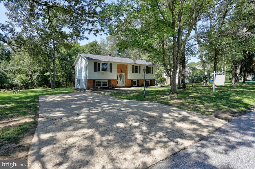 Fantastic home located in the community of Long Point on the Magothy. 117 Circle Road offers a blend of comfort and luxury. The split foyer design provides a bright and open floor plan on both levels.  Upper level highlights include stunning hardwood floors throughout, large living room and separate dining room with deck access, upgraded kitchen with island and stainless steel appliances, primary bedroom with bathroom, two additional bedrooms and a second full bath. Lower level features a spacious family/recreation room with a wood-burning stove, bar with built-in refrigerator and quartz counter, third full bathroom, large storage/laundry area, versatile for use as an exercise room or workshop.  Home sits on a  .34 acre lot with a built-in saltwater pool and trees offers a great mix of outdoor space and natural beauty. This home is situated in a water-privileged community with beach access and boat ramp for a small yearly voluntary HOA fee. Convenient to BWI Airport, Ft Meade/NSA, Annapolis, Baltimore, DC, Northrop Grumman, Johns Hopkins, University of Maryland Medical Systems,  US Naval Academy, Restaurants, County Parks and more!  It truly offers a wonderful lifestyle for those who enjoy both indoor and outdoor living.