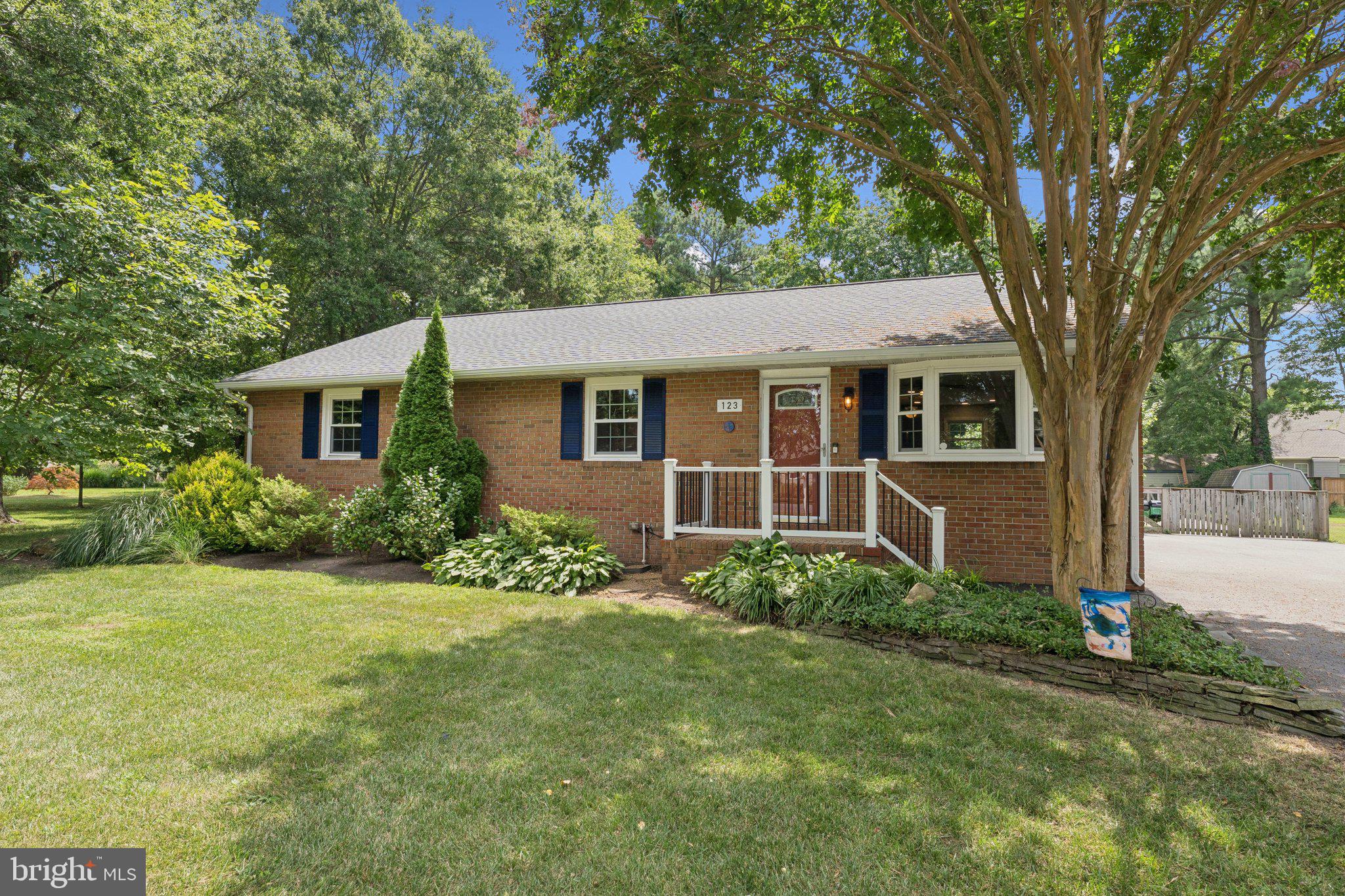 Welcome to easy Eastern Shore living in this beautifully maintained single-level, brick front home just steps from the Cross Island Trail and community beach! Nestled among lush, green landscaping, this charming 3-bedroom, 2-bath home offers an open-concept layout with warm hardwood floors throughout. The updated kitchen is perfect for cooking and entertaining, flowing effortlessly into the living and dining spaces.
Welcome guests on the inviting front porch and enjoy your evenings on the expansive back deck, complete with a hot tub—ideal for unwinding under the stars. The fully fenced backyard provides privacy, while the large driveway and oversized workshop shed offer plenty of space for vehicles, hobbies, or storage.
With updated mechanicals, a newer roof, and thoughtful improvements throughout, this home is move-in ready and low-maintenance. All this, surrounded by nature’s beauty and just a short walk to trails, water access, and the tranquility you’ve been searching for. Don’t miss your chance to live where peace meets convenience!