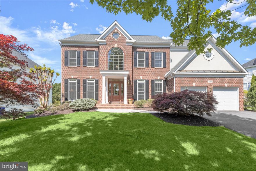 Stunning Colonial-style home in the sought-after Grovemont community, offering over 5,000 sq ft of beautifully finished living space. This impressive residence features 5 bedrooms, 4.5 baths, and expansive living areas designed for both everyday comfort and elegant entertainment. The main level showcases a refined yet functional layout, beginning with a formal living room accented with crown molding and a spacious dining room with box wainscoting and a convenient butler’s pantry. The gourmet kitchen serves as the heart of the home, complete with stainless steel appliances, a center island, range hood, breakfast room, and a planning station, perfect for both daily living and entertaining. The family room offers a warm and inviting atmosphere with a fireplace and custom interior window shutters. A private home office and powder room complete the main level. Upstairs, the home continues to impress with generously sized bedrooms, including a luxurious primary suite featuring a sitting room, and a stunning renovated full bath with a standalone soaking tub and dual showerheads, creating a true spa-like retreat. A standout feature is the beautifully renovated upper-level secondary baths, showcasing sleek, modern design and finishes. The fully finished lower level expands your living space with an expansive recreation room, a dedicated exercise room, an additional bedroom, and a full bath, ideal for guests or extended living. Ample storage space adds to the home’s functionality. Recent updates include an Andersen front entry door, Andersen windows throughout, all bathrooms, lower-level carpet, cooktop, range hood, refrigerator, washer, dryer, tankless water heater, HVAC, custom closet systems, upper-level recessed lighting, gutter guards, irrigation system, roof (2019), and a whole-house water filtration system. A finished 2-car garage with built-in cabinetry adds convenience and excellent storage. With its blend of thoughtful updates, timeless design, and generous space, this exceptional home offers the perfect balance of luxury, comfort, and functionality.