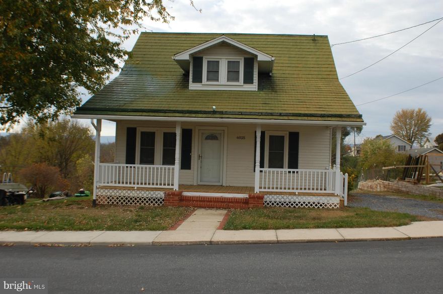 Totally remodeled! Spacious rooms.  All the convenience of living in town with a picturesque mountain view from your front porch! It is move in ready! Separate dining room. Kitchen has a breakfast nook. Master bedroom & bath upstairs.  Master bath has dual sinks & Jacuzzi tub with the mountain view. Large front porch! Large Yard with a garage/shed combo, has a garage door and an entry door.