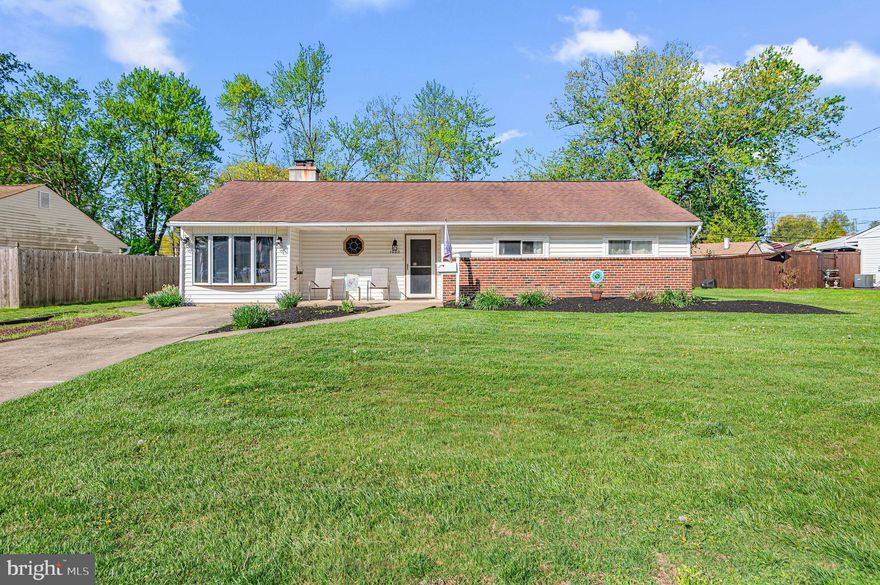 Welcome to this spacious 4-bedroom, 2.5-bath rancher offering an expanded layout and modern updates, with approximately 1,861 sq ft of living space. A welcoming foyer entry features a coat closet and opens to a bright living room with vaulted ceilings, a wood-burning brick fireplace, and a large bow window. Wood-look ceramic tile flooring runs seamlessly throughout the living room, dining room, hallway, and three bedrooms. The modern kitchen was remodeled in 2019. It features newer white base and overhead cabinetry, a stainless steel sink, dishwasher, garbage disposal, pantry cabinet, and a side-by-side stainless steel refrigerator with lower pull-out freezer. Additional highlights include a four-burner electric range with a built-in microwave above and recessed lighting. A hallway pantry closet provides added storage, along with a conveniently located modern half bath with a pedestal sink. The original garage has been removed to expand the home, and a substantial rear addition adds even more living space. The addition includes a large family room with recessed lighting, a ceiling fan, and sliding glass doors leading to the fenced backyard, ideal for outdoor gatherings, pets, or play, plus a detached shed for storage. This home features two primary bedrooms. The primary bedroom in the addition includes a spacious walk-in closet, recessed lighting, a ceiling fan, and an ensuite bathroom offering a stall shower, vanity, and ceramic tile flooring. The three bedrooms in the original portion of the home are well-sized and feature double sliding-door closets and lighted ceiling fans. The hall bathroom includes a jetted tub with ceramic tile surround, a separate stall shower, ceramic tile flooring, and a vanity with a large mirrored medicine cabinet. Additional features include six-panel interior doors with chrome hardware, a new central air system installed in 2024, a new boiler installed in 2019, a new sewer pipe from the house to the township line in 1998, a whole-house Generac generator, and a mechanical/laundry room with a front-loading washer and dryer included. Also included is a 1 year AHS Home Warranty. Conveniently located just one block from Hampton Square Mall, providing easy access to shopping, dining, and everyday essentials. Room measurements and total square footage are based on a CubiCasa floor plan; buyers should verify for their own satisfaction.