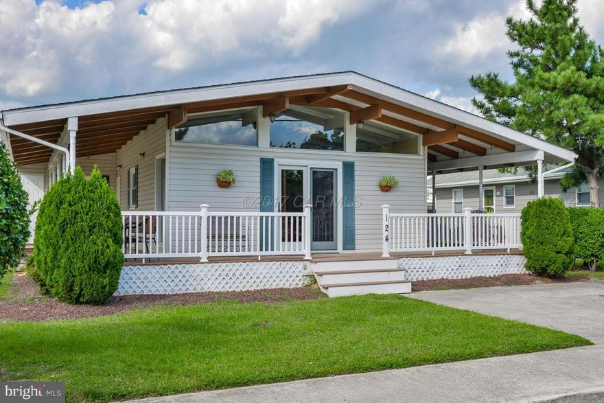 Charming beach cottage with original hardwood floors. Large wrap around porch for enjoying the sunsets. Waterfront with private boat dock & outside shower. Beautifully decorated & ready to enjoy! Large open kitchen / living area for entertaining. Short walk to the beach. Great rental potential. NO HOA FEES!